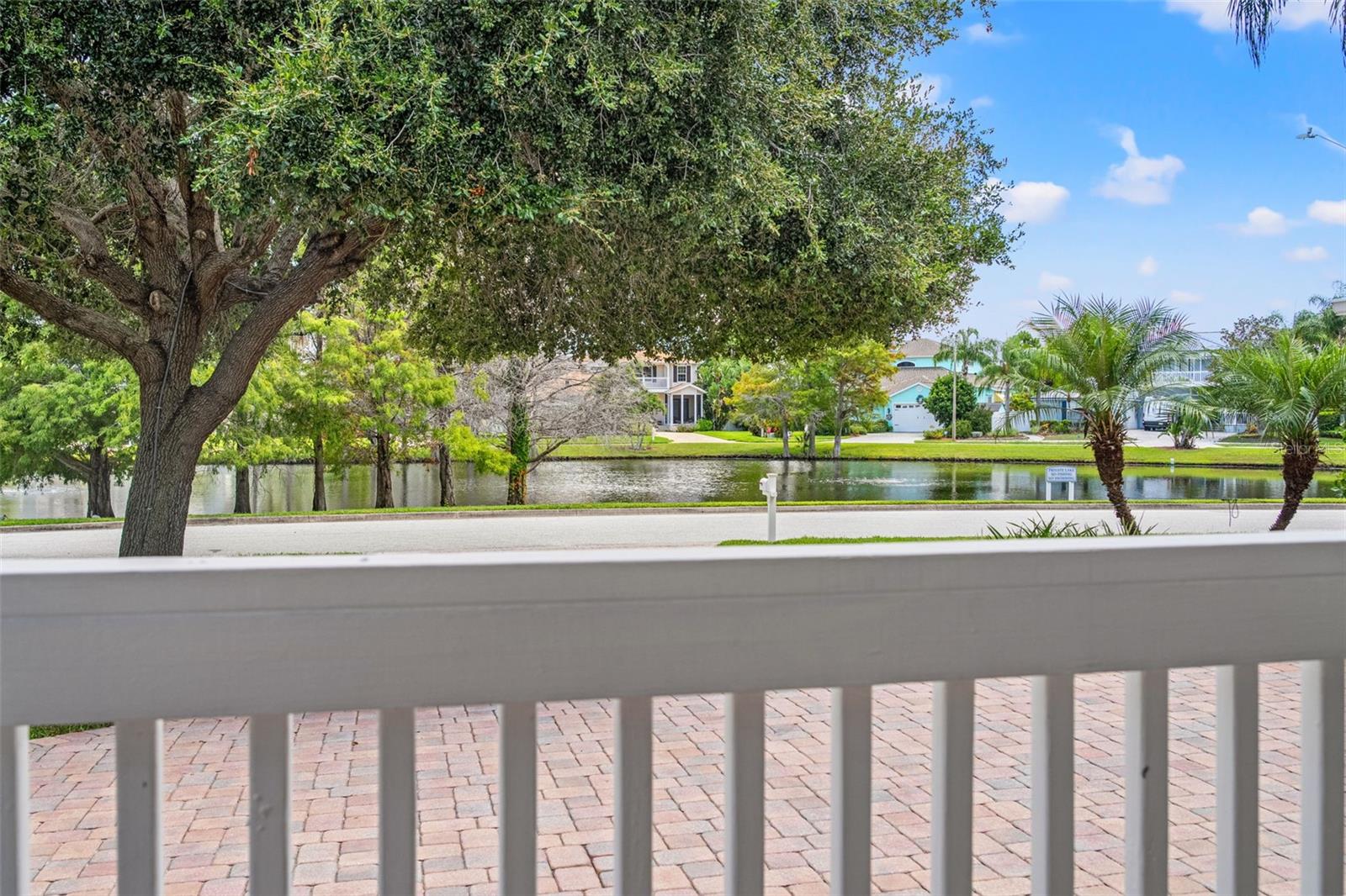 Relax on the front porch and enjoy serene water vistas and natural surroundings.
