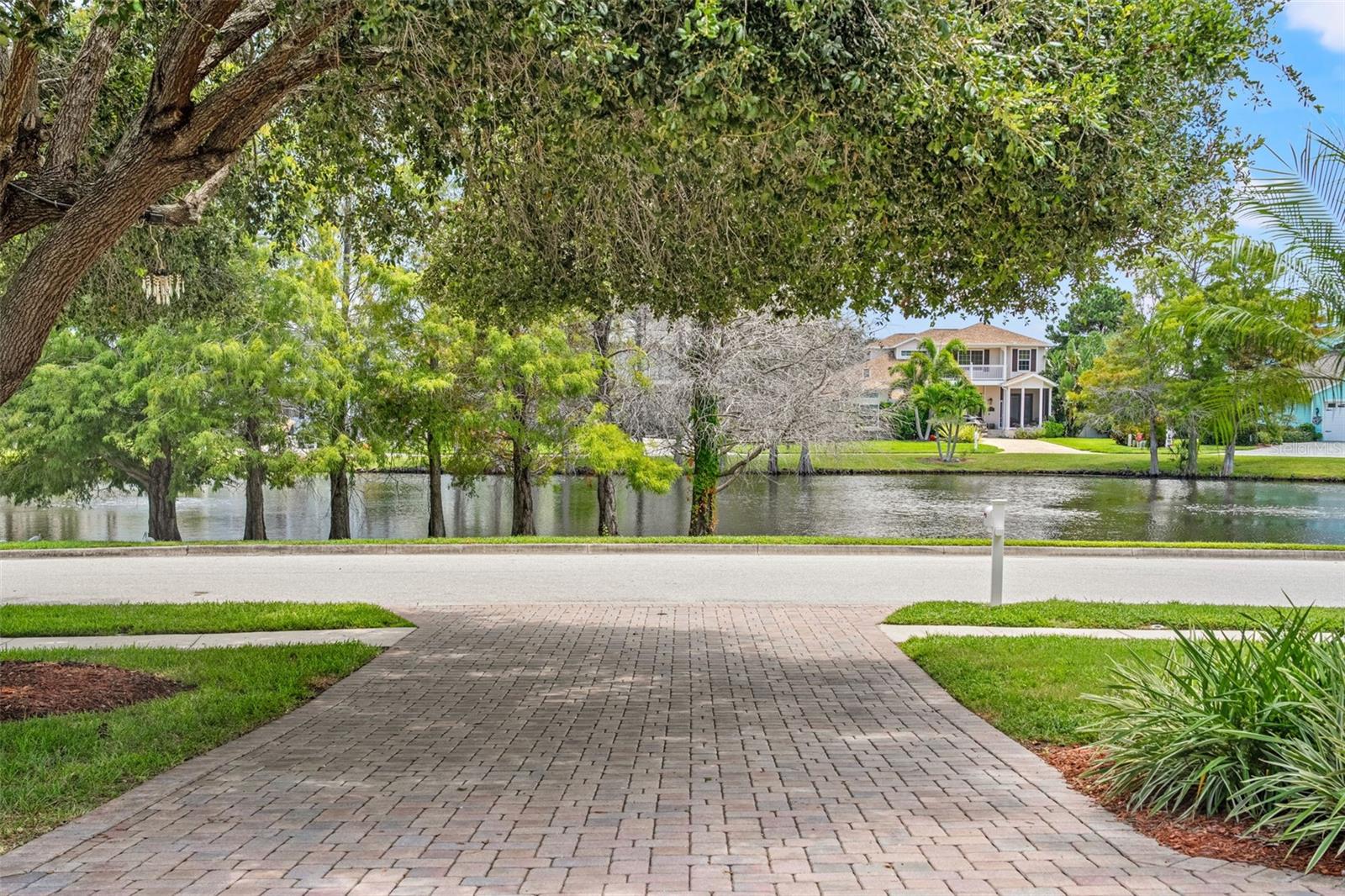 Expansive views of the pond create a tranquil setting as you arrive home.