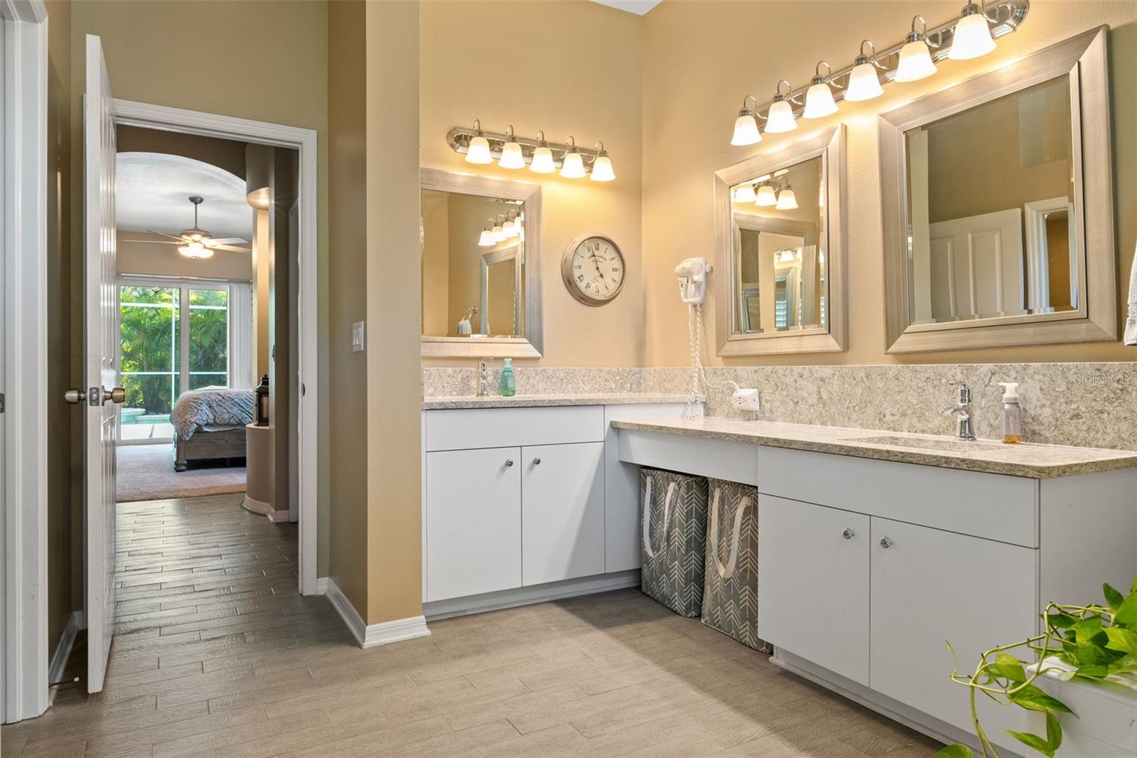 Double vanities with ample counter space and under-cabinet storage provide convenience and style, ideal for daily routines.