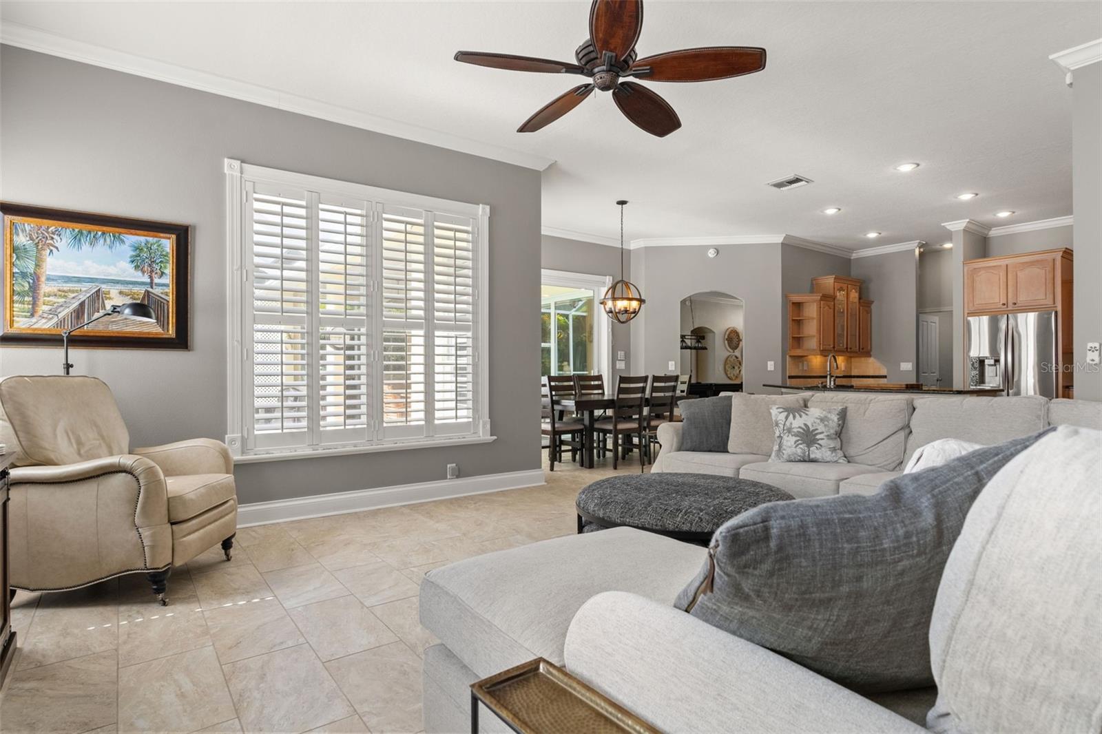 This angle shows the family room’s proximity to the dining nook and kitchen, all styled with coordinating finishes and abundant natural light.