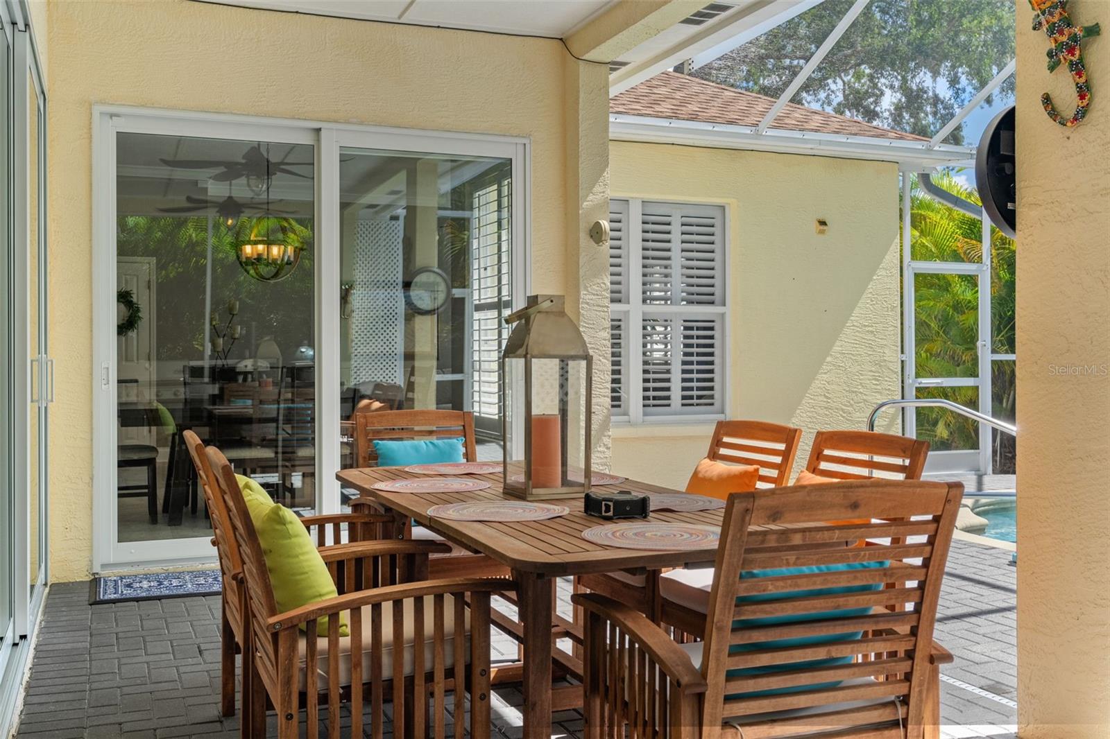 Relax with pool views from the comfort of the lanai, with a clear line of sight to the spa and surrounding greenery.