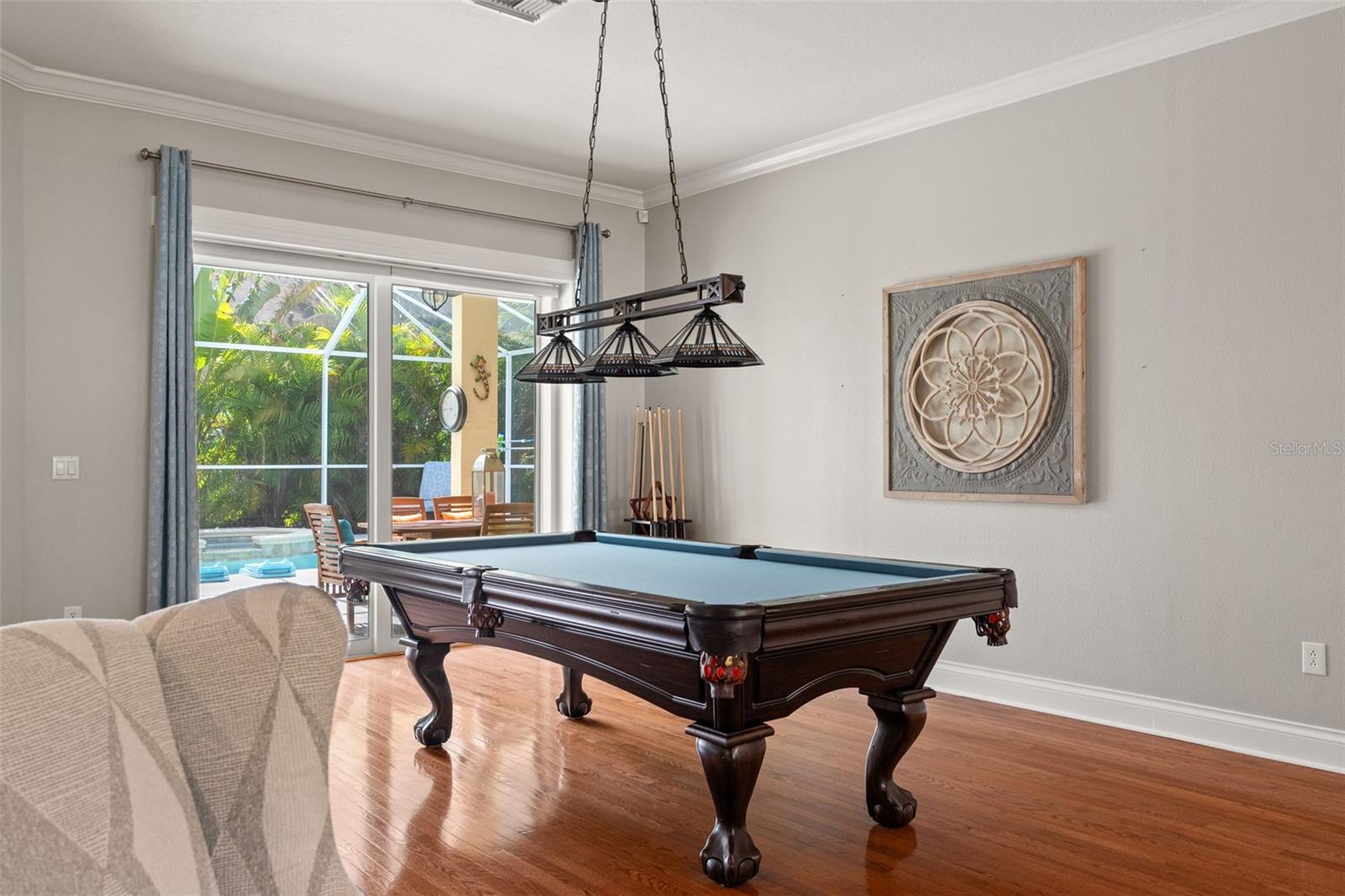 Detailed view of the dining room’s elegant finishes with wood floors adding a polished touch to this inviting space.