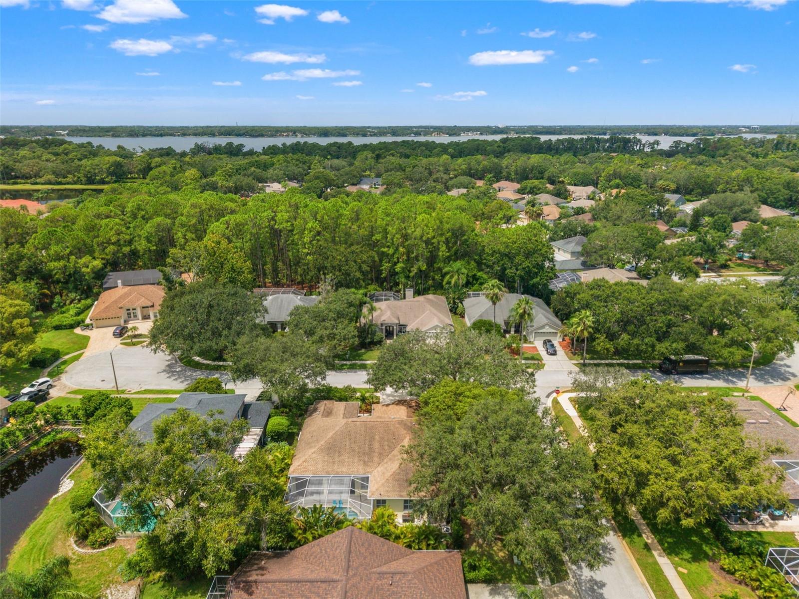 The property is located just minutes from serene lakes and preserves, providing a peaceful yet convenient setting.