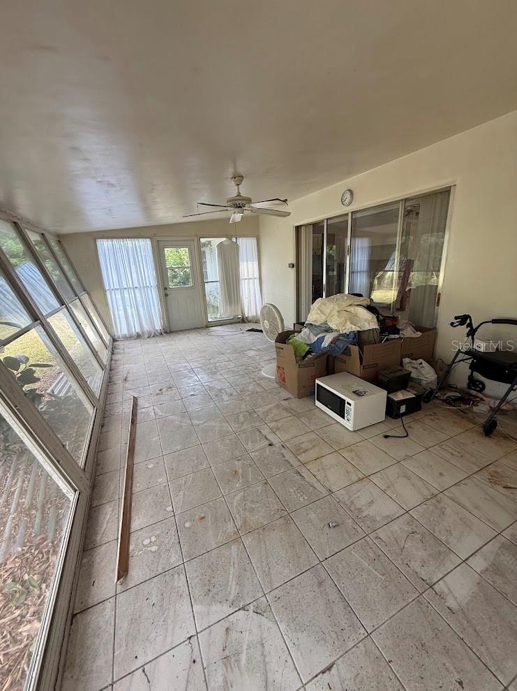The Florida room extends seamlessly from the dining area and offers versatile options.  Ideal for a bedroom, den, office, or flex space to suit your needs.