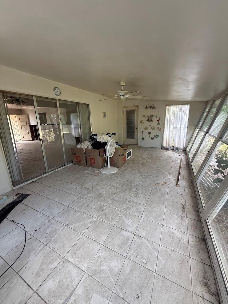 Plenty of natural light filters through the Florida room.  There is access to the backyard from this room.