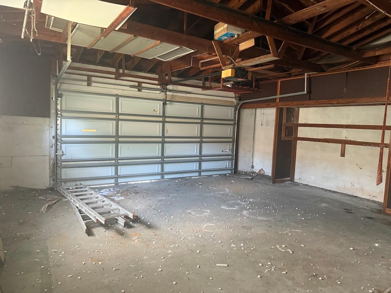 The home features a two car garage, hurricane bars and high ceilings.