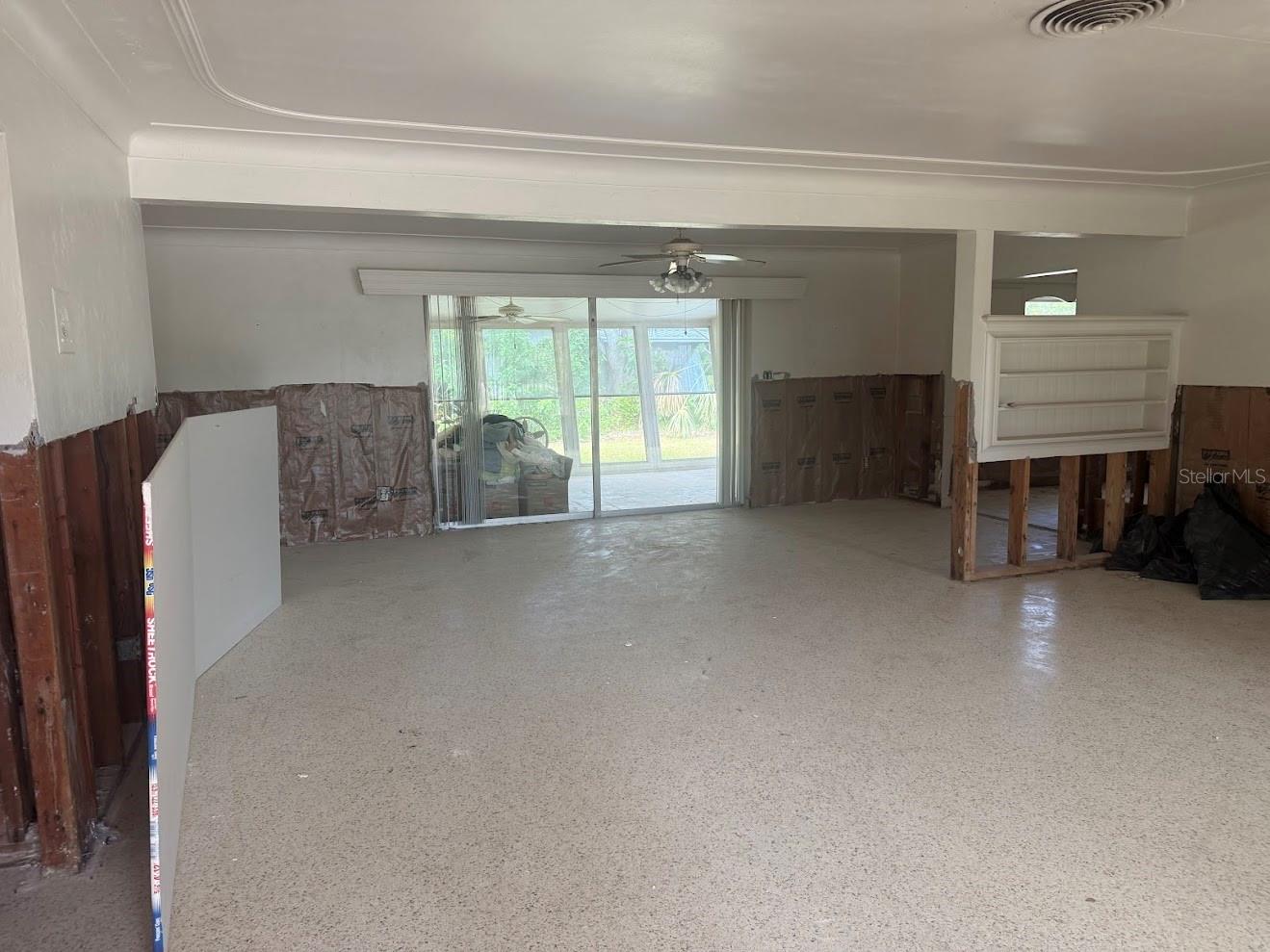 The formal living room flows perfectly into the formal dining room.