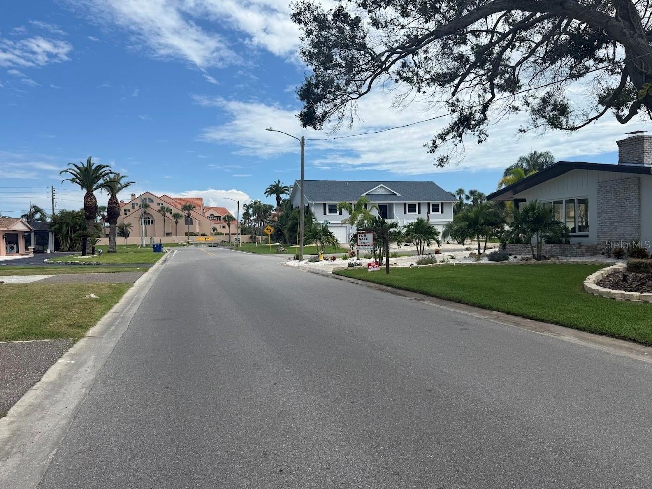 The home is nestled next to gorgeous homes and in walking distance to the famous Pasadena Yacht & Country Club golf course.