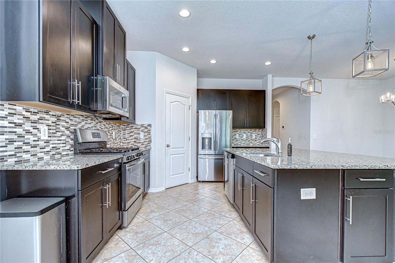 Beautiful granite countertops and tile backsplash!