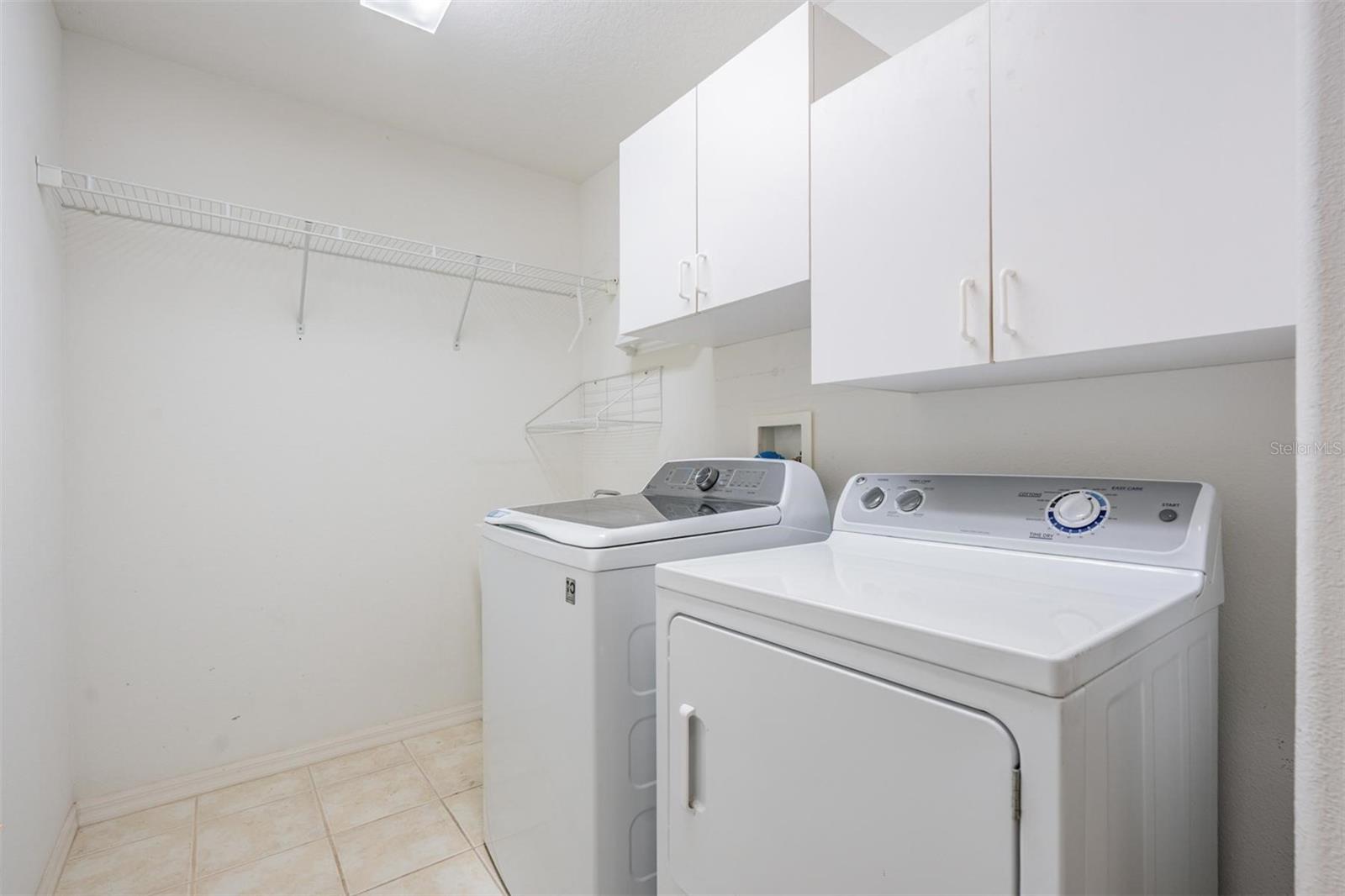 Walk-in laundry room with additional storage options