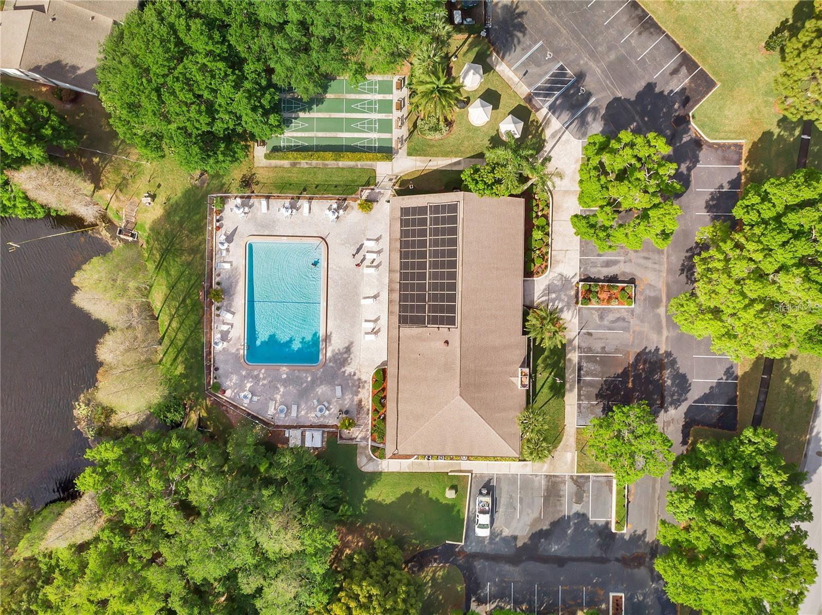 Overview of clubhouse, pool, shuffleboard courts & picnic area