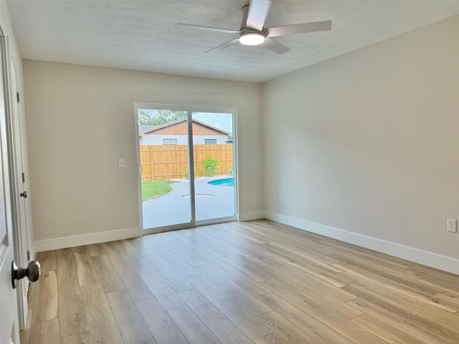 Master bedroom with private key-entry sliding glass door