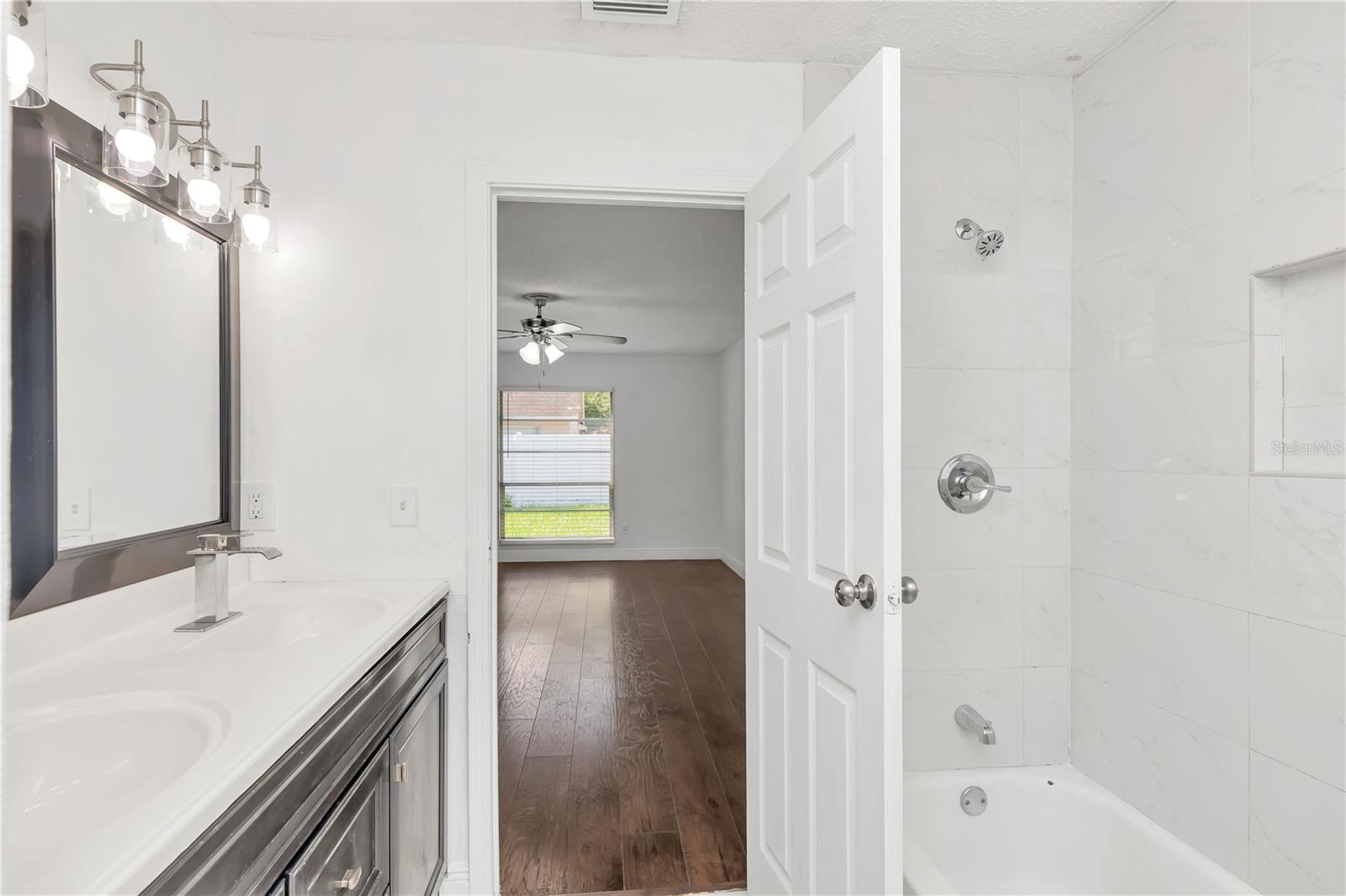 View from primary bathroom to primary bedroom