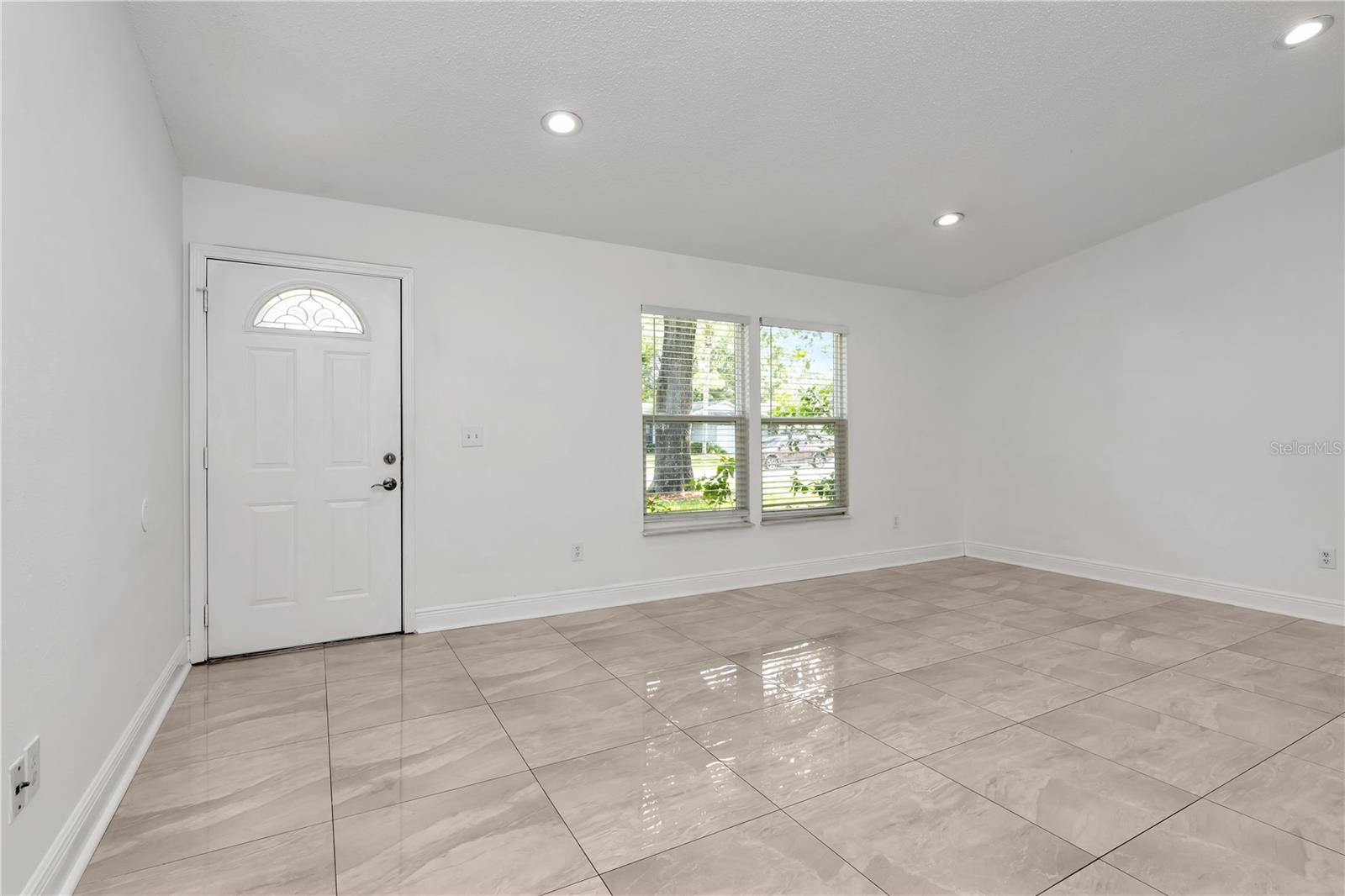 High ceilings and an open layout create a sense of vastness, offering a warm welcome the moment you step inside.
