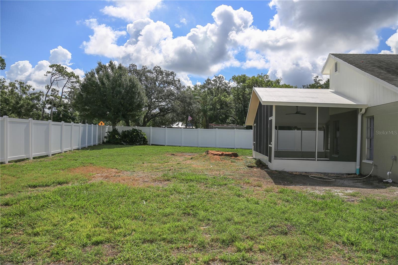 Exterior backyard with new vinyl fence