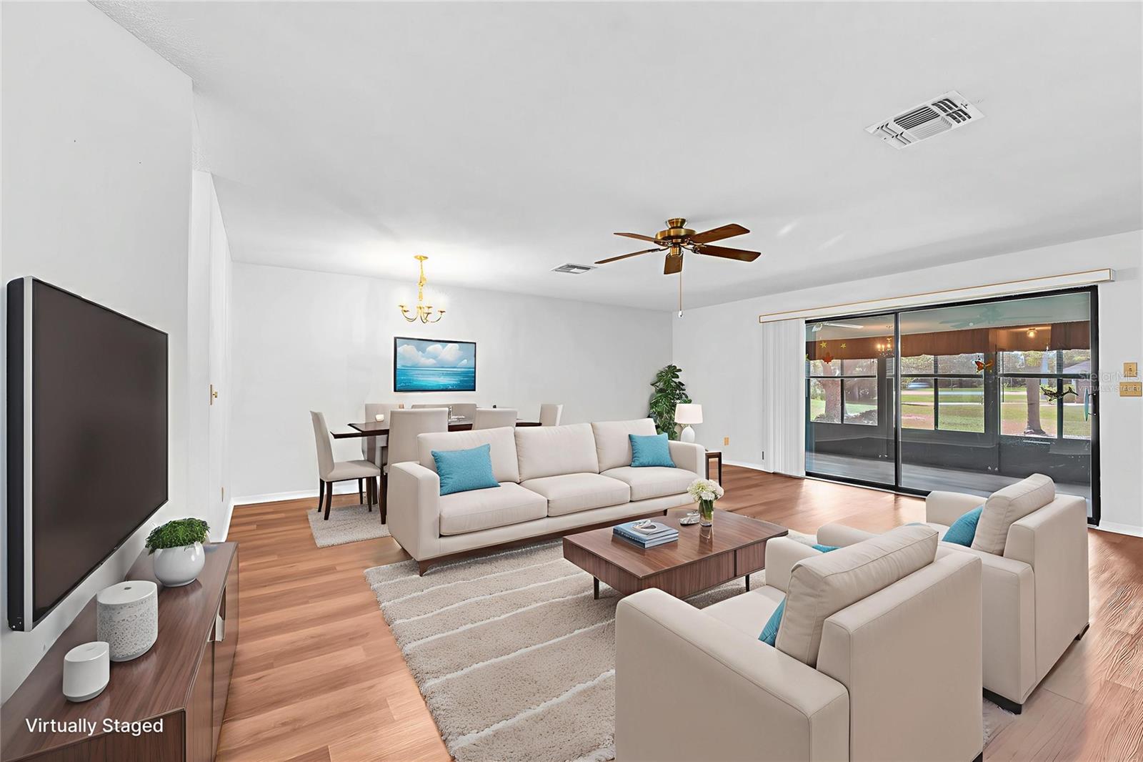 Great room with sliders out to the enclosed porch.