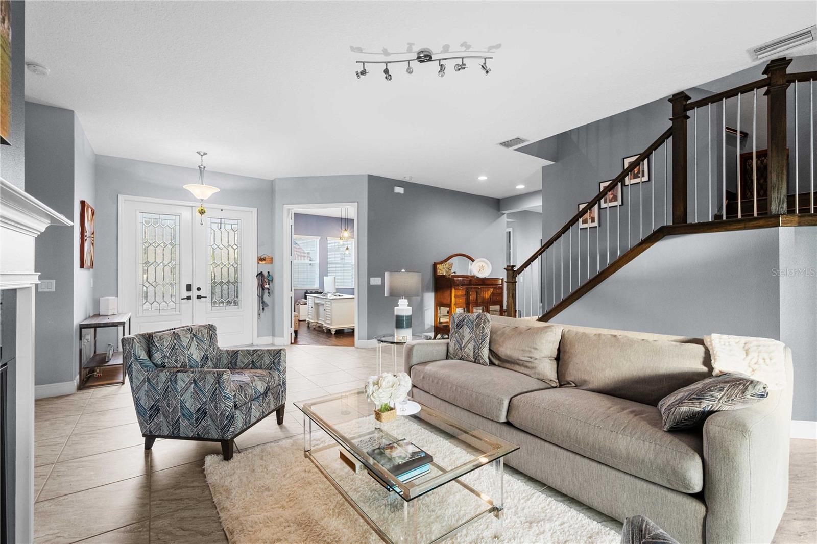 Living room with view of stairs