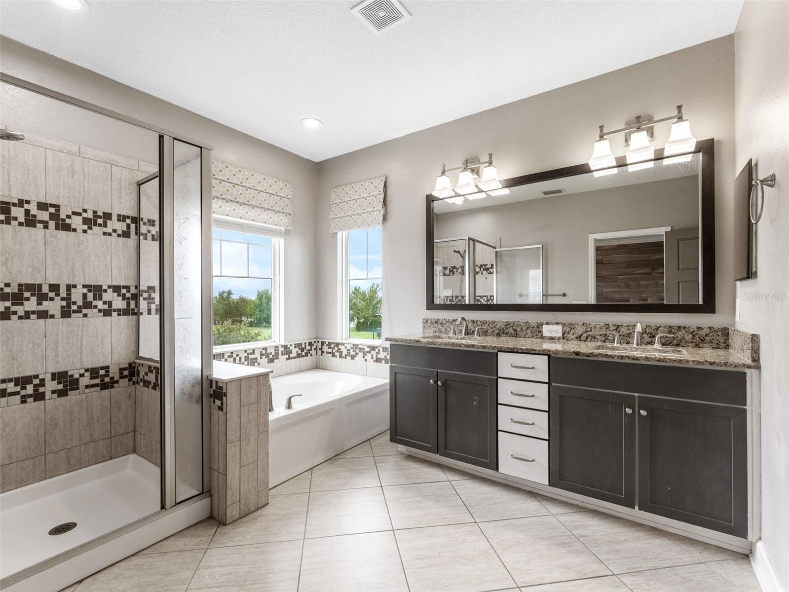 Master Bathroom with granite countertop and dual vanity!
