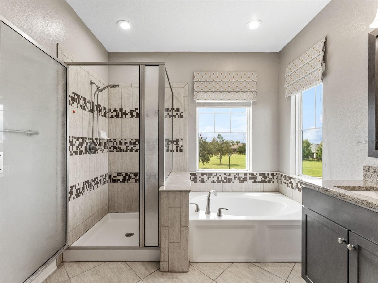 Master Bathroom with Round tub, and separate shower.
