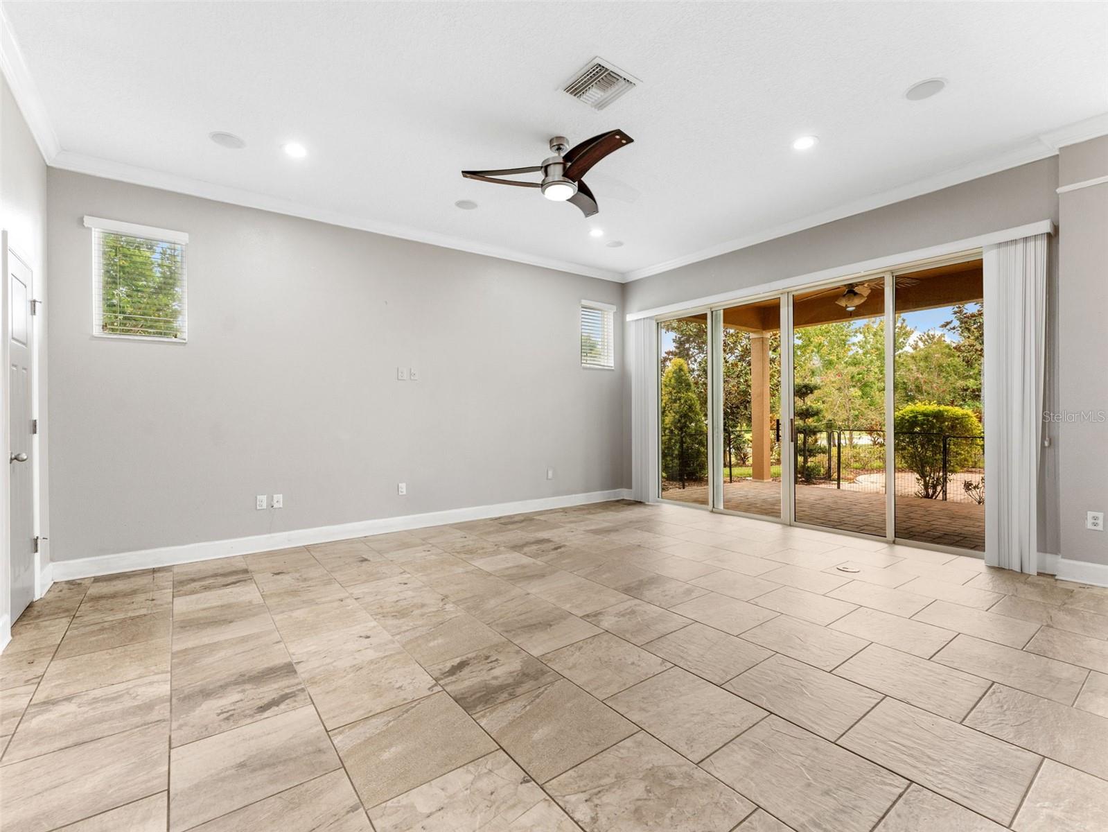 Family Room with Sliding Glass Doors and Windows for Extra Natural Light!