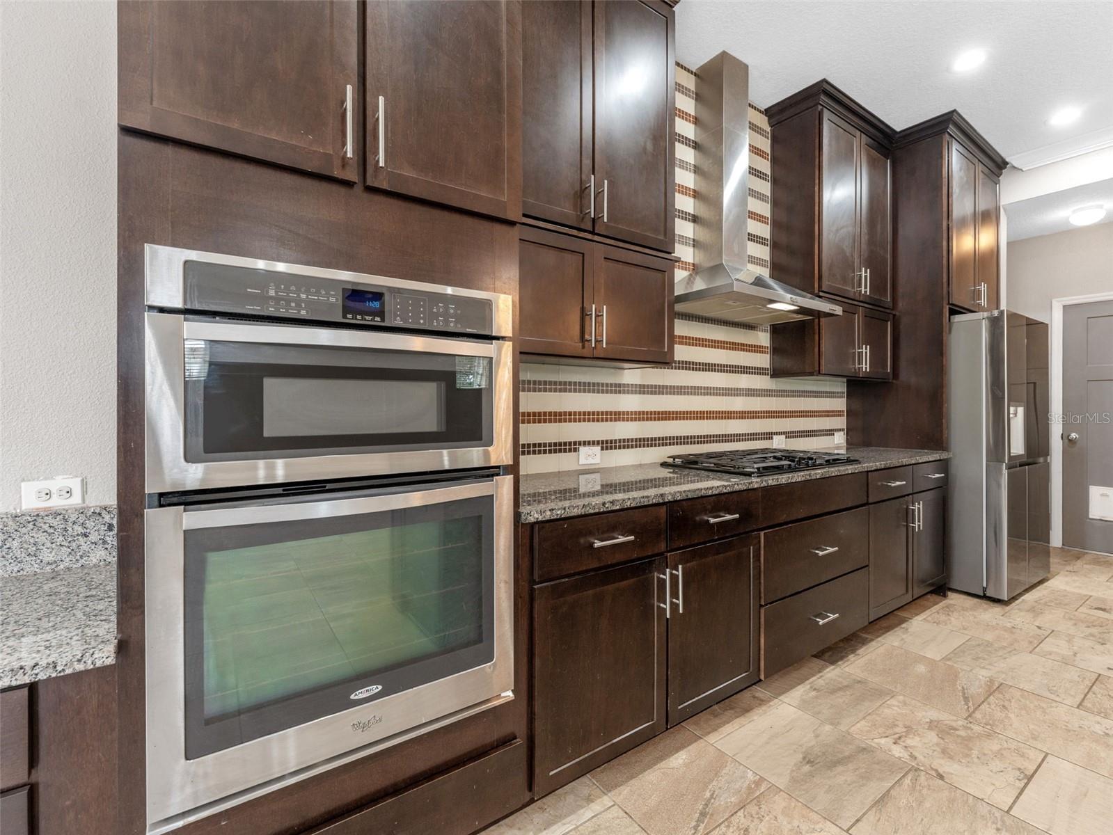 Kitchen Designer Stainless Hood and Gas Cooktop and Built-in Oven and Microwave Combination!