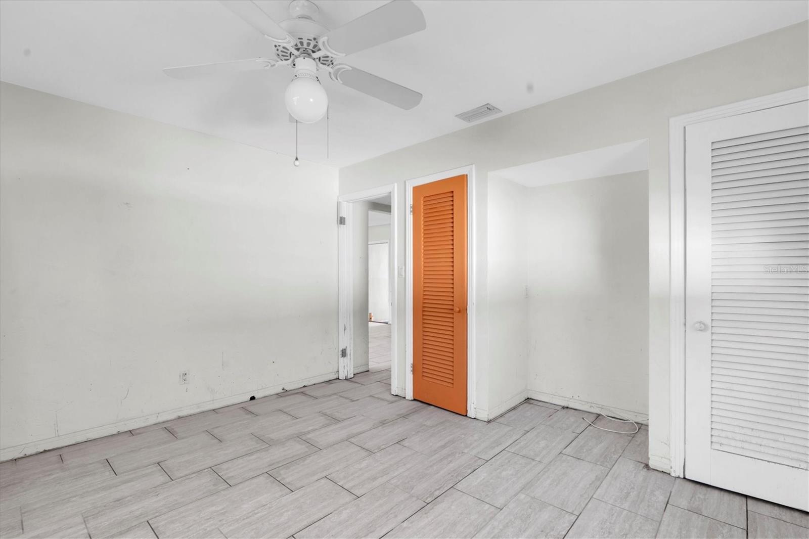 Bedroom with window to back yard