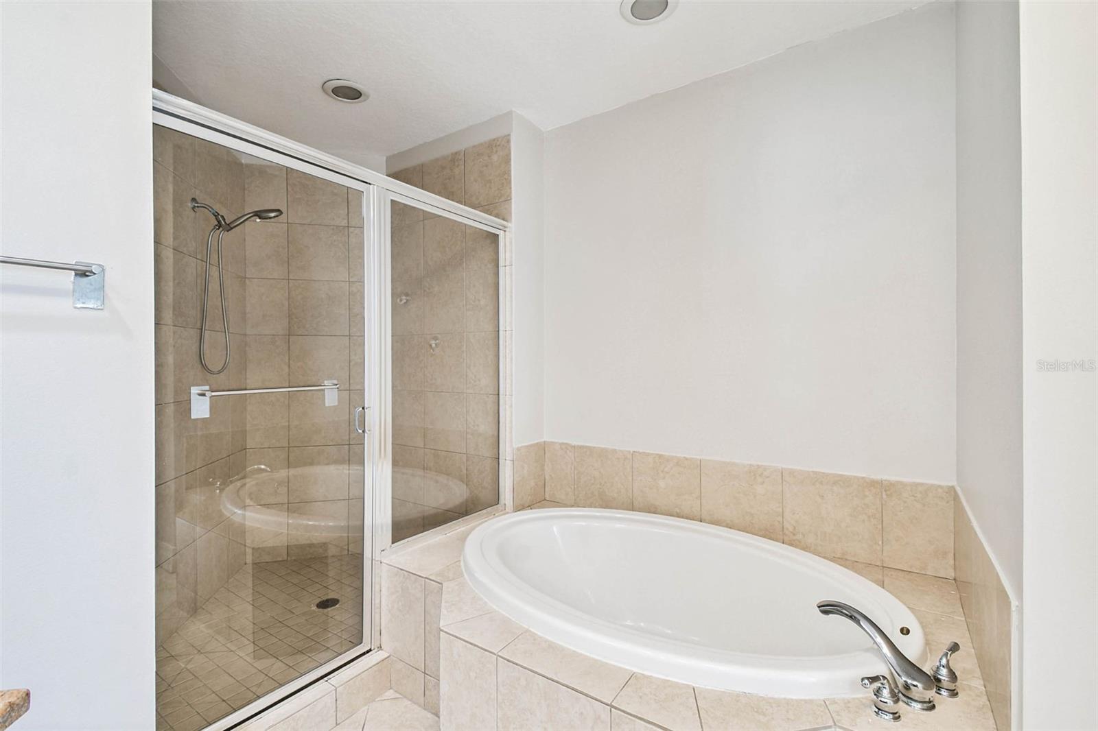 Master bathroom with soaking tub and walk-in shower