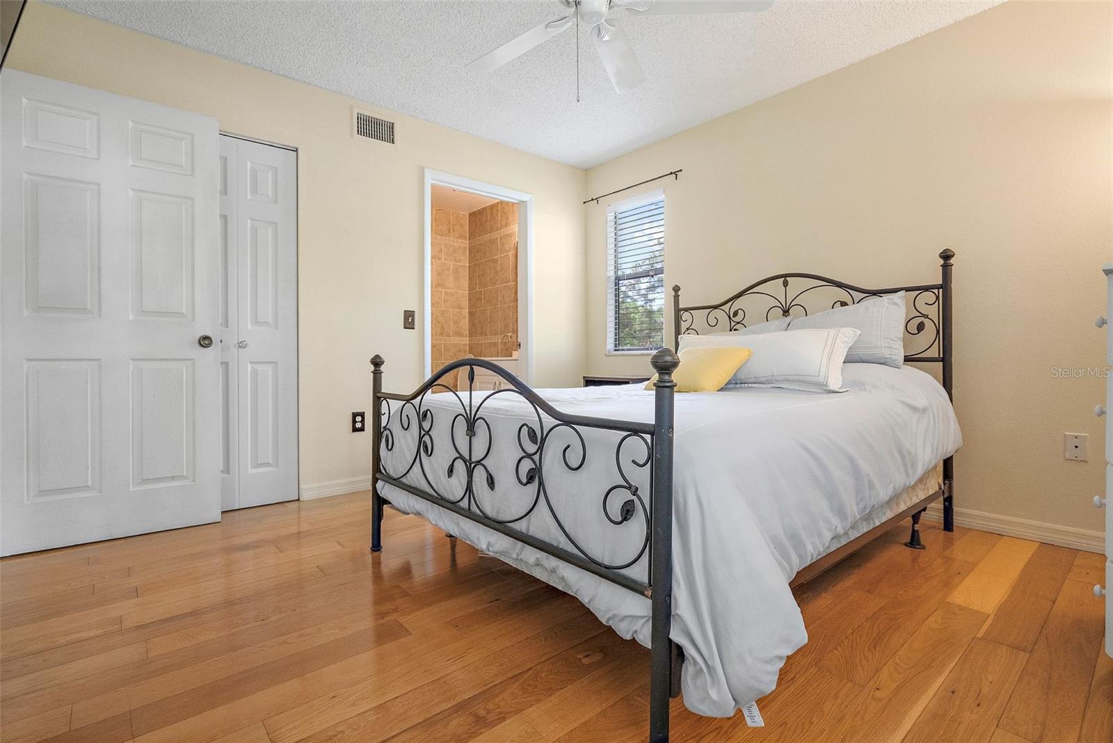 Primary bedroom with walk in closet and full bath