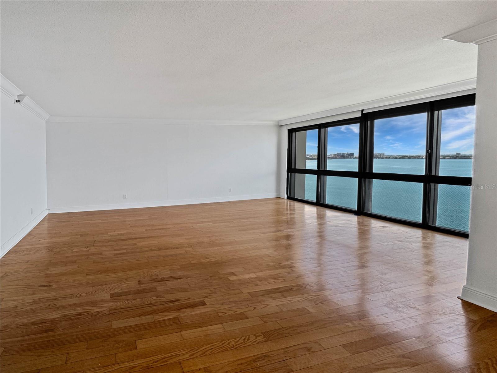 Spacious living room with waterfront views.