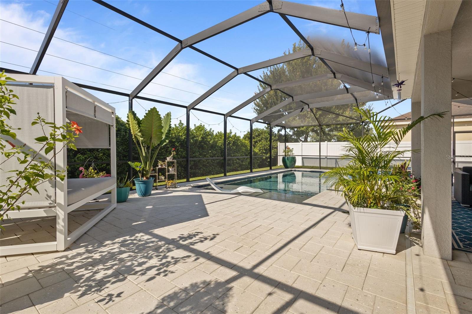 Saltwater heated screened in pool with in ground hot tub
