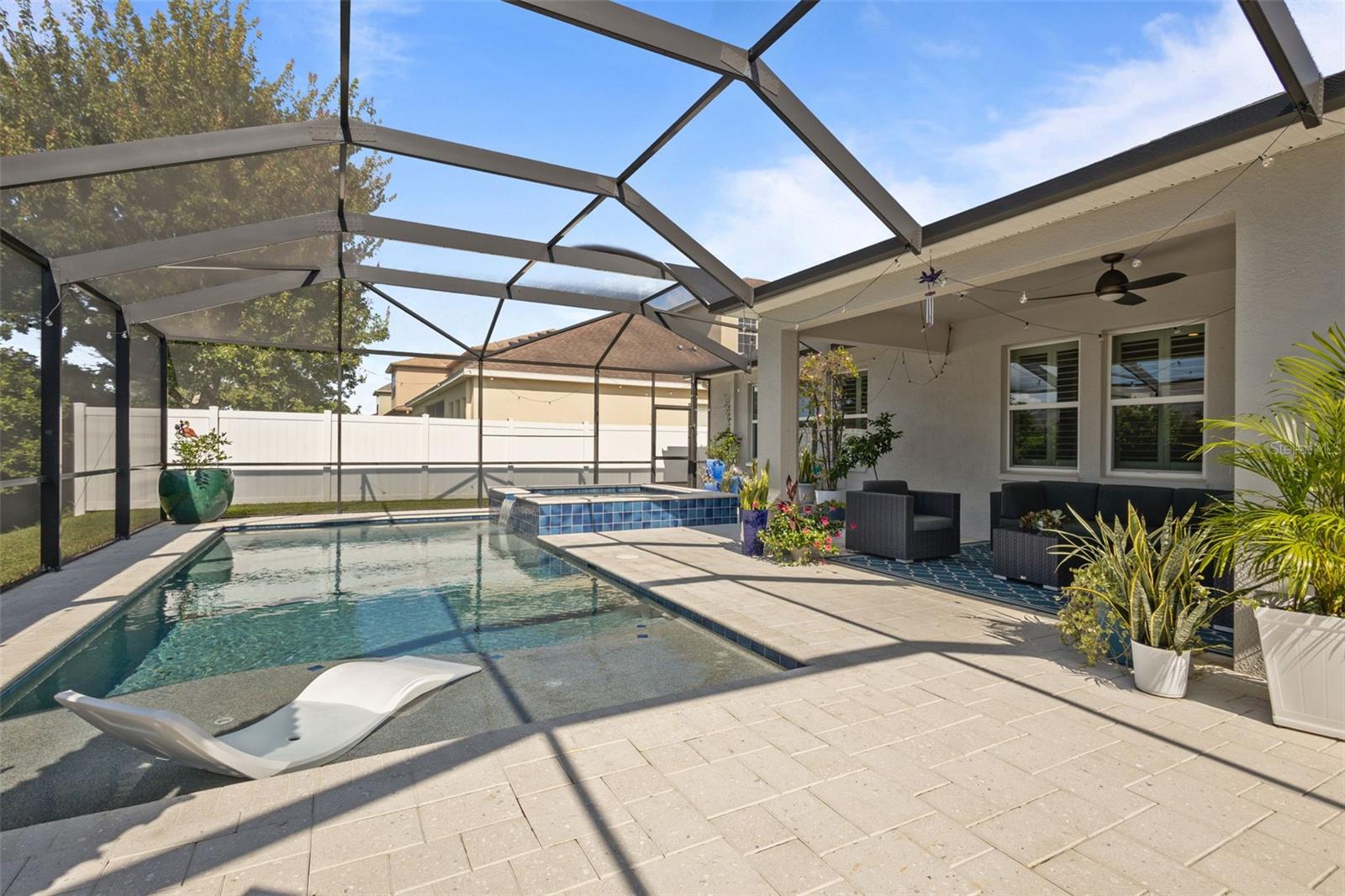 Saltwater heated screened in pool with in ground hot tub