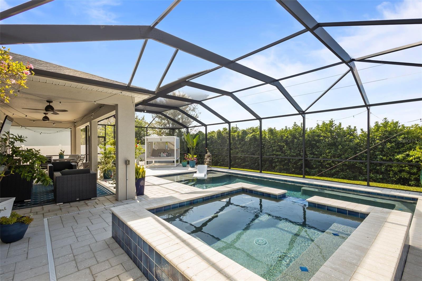 Saltwater heated screened in pool with in ground hot tub