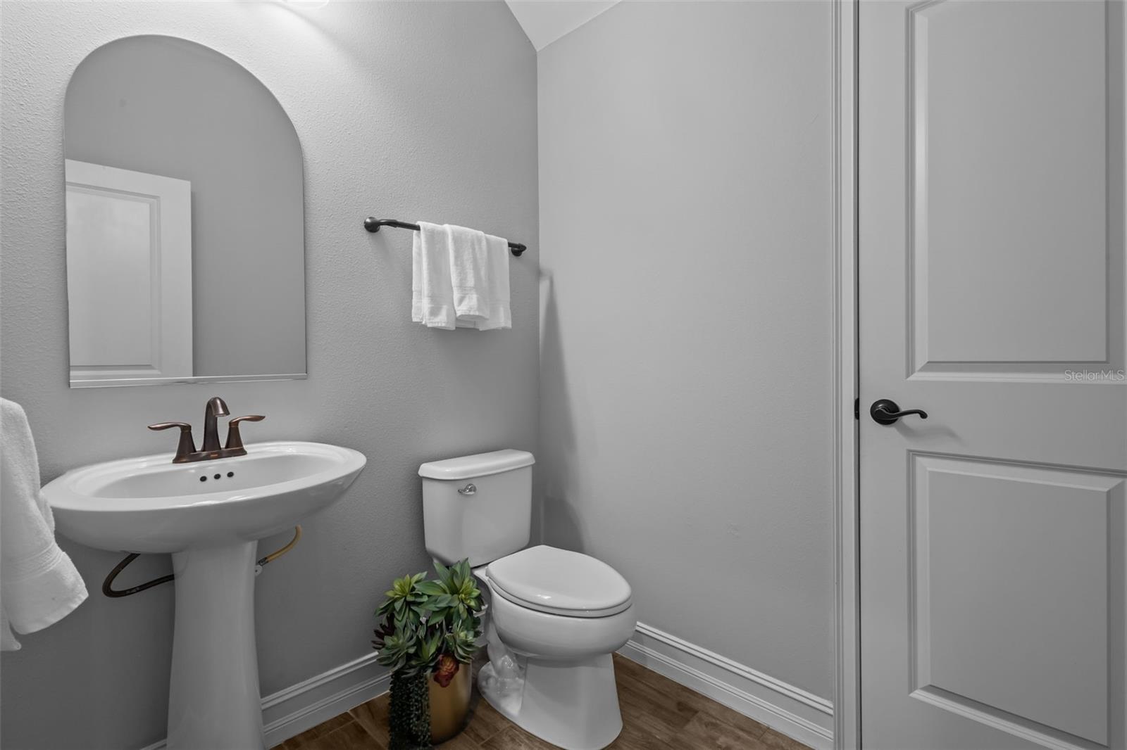 Downstairs half bath off main hallway
