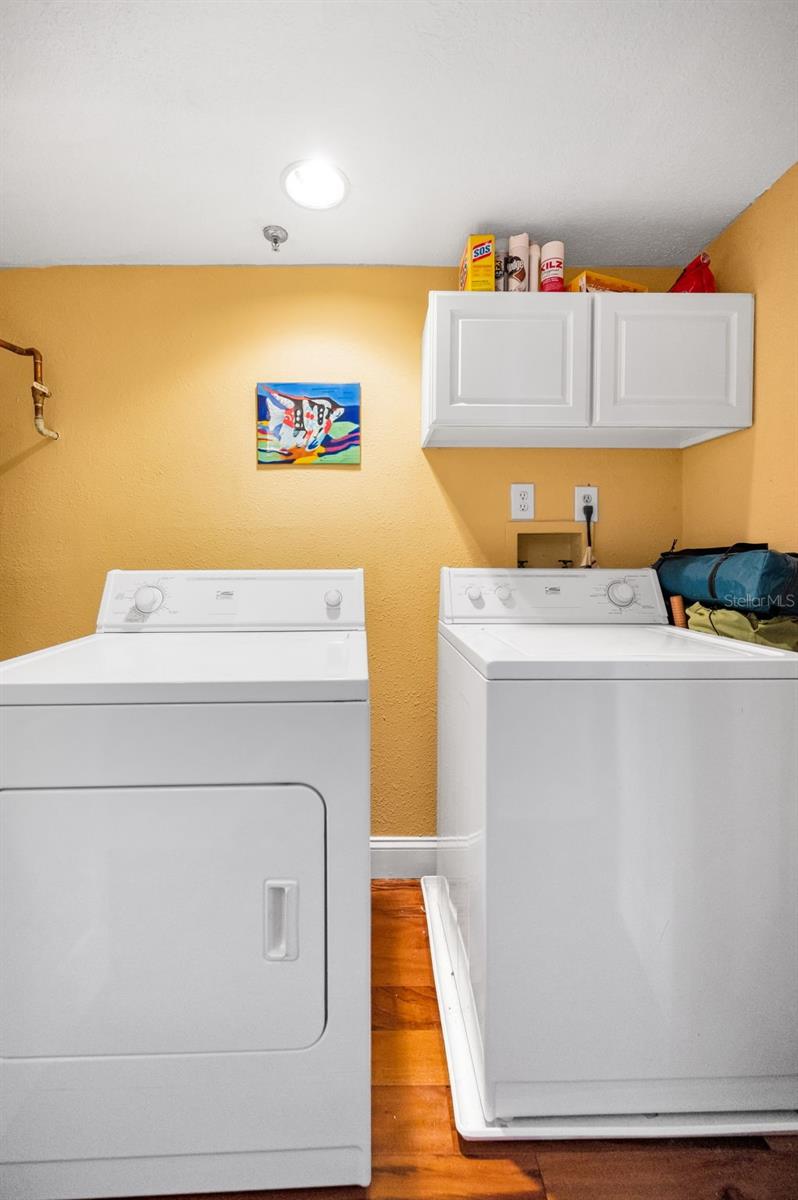 ... 10' x 3' Laundry Closet in Hallway - There is Shelving to Left in Photo.. Located on Main Floor in Hallway between Kitchen & Entrance Foyer.