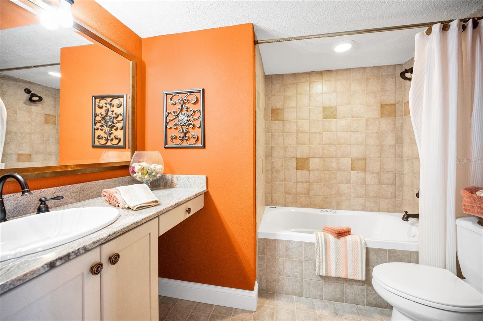 .. Guest Bedroom # 1 En-Suite With it's Own Full Bath. Owners Have Decorated Each Room With Care.  I used to Live in Los Angeles California . This Home Reminds me of Houses Up in the Hills atop Malibu before the Whole World went Gray and White.