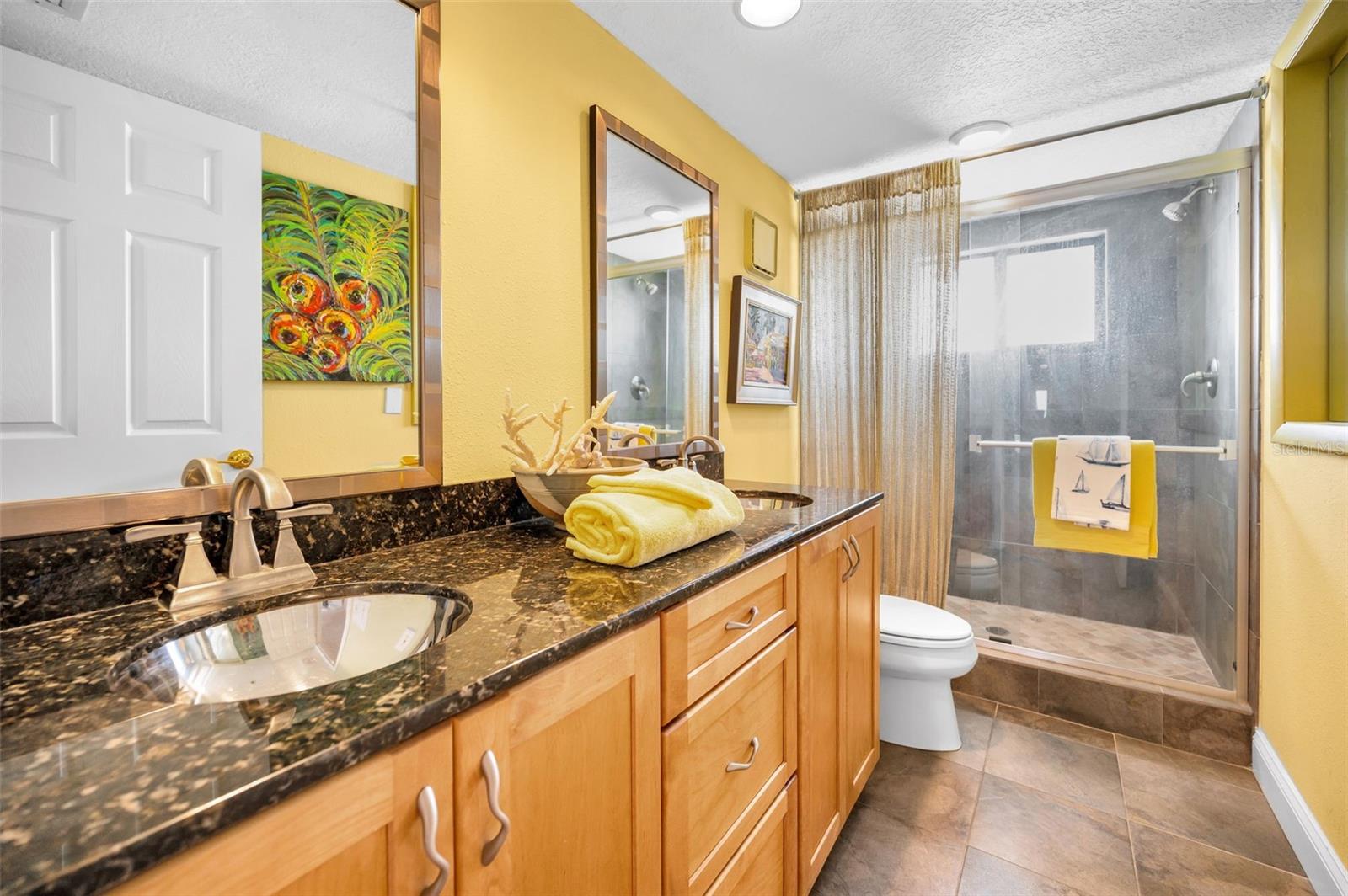 ... Hall Bath 11.3 X 5.4  With Walk In Shower, Double Vanity Sinks and Granite Counter Tops.  This Bathroom Though Right Next To The Guest Bedroom #2  Also Services the Common Area. .