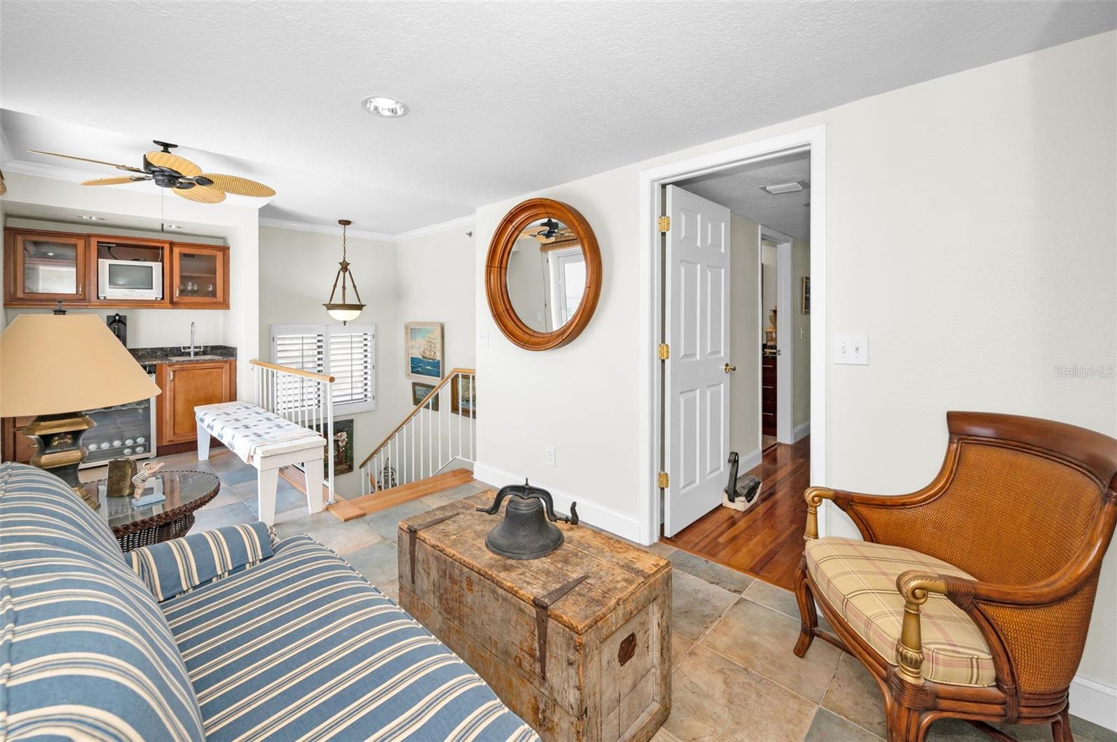 .. Loft Parlor Room  22.6 X 8' With Master / Primary Suite Thru Door on Right. Rooftop Patio Entrance on Right - Past Lamp. Wet Bat 5' x 3' complete With Sink - Wine or Beverage Fridge & Overhead Cabinets next To Rooftop Patio comes in REal Handy.