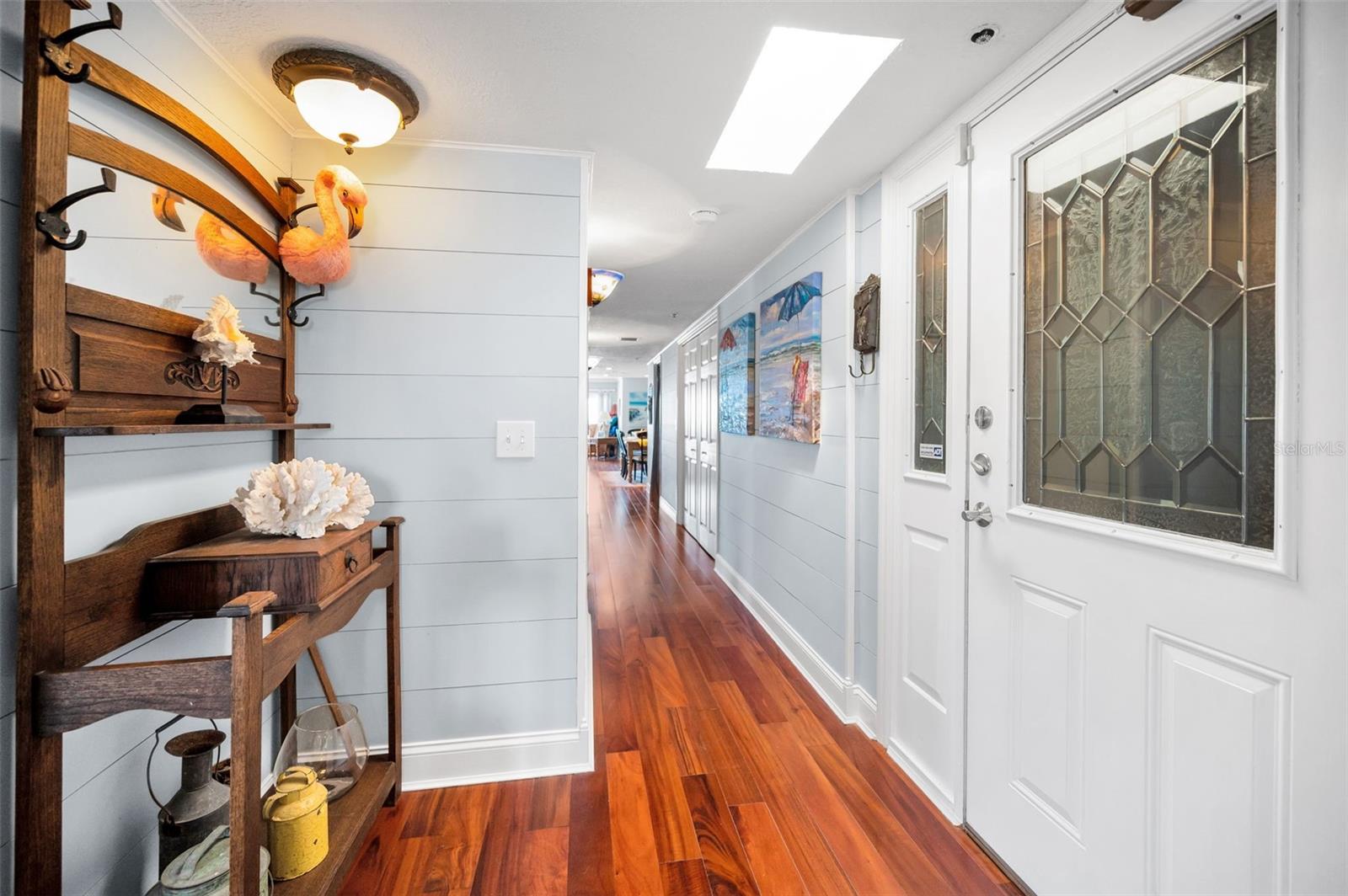 .. Sellers done a Wonderful Job of Decorating With a Malibu California Beach Look. Skylight in Photo Illuminates Entry with Natural Light. Brazilian Engineered Hardwood Floors Bring a Natural Beach Feel to PH Residence # 5..