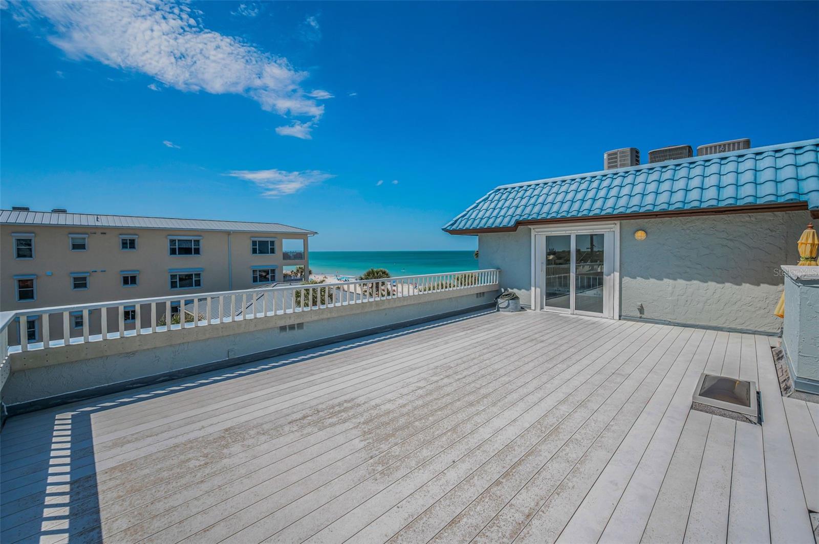 .. Small Skylight on Roof Top Patio Brings Natural Light into PH Residence #5 Foyer Inside the Unit.  Nice Aerial  Highlighting Private Rooftop Patio With  Beach Views from SW Corner PH. .. Patio Enjoys Views Both East & West .. You  can see Sunrise - Sunsets - Gulf Blvd Parades - And Beach & Gulf Views.