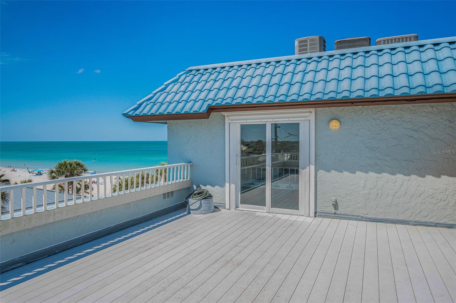 .. View Looking Due West From Penthouse Roof Top Patio. Sliders Open to Parlor Room Inside PH Top Floor. This Deck is Private and Conveys with  PH #5.