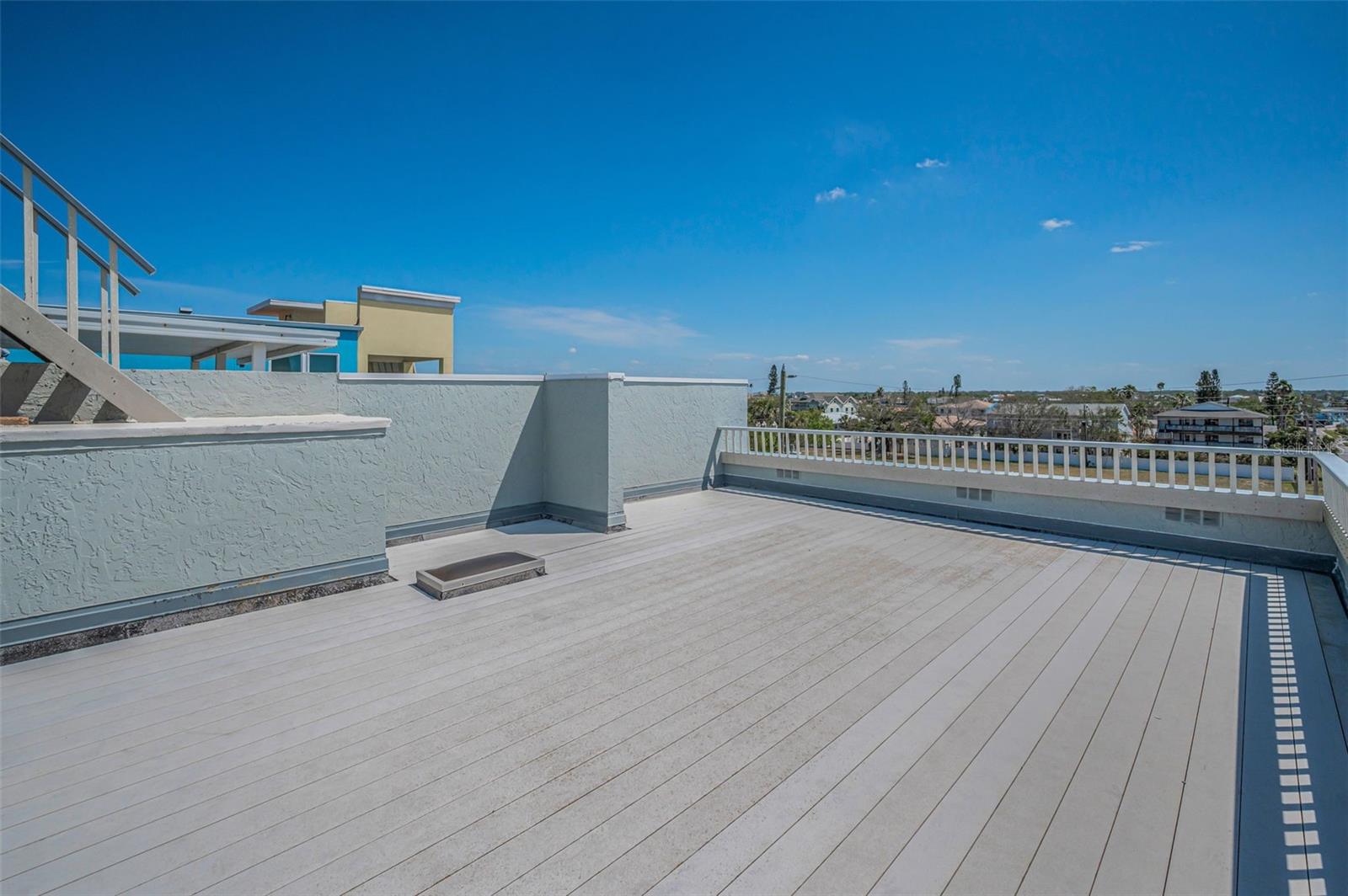 .. Roof Shot of  Deck . NOTE: Small Skylight on Rooftop Brings in Natural Light to PH Residence #5 Inside Foyer / Hallway By Unit Door.