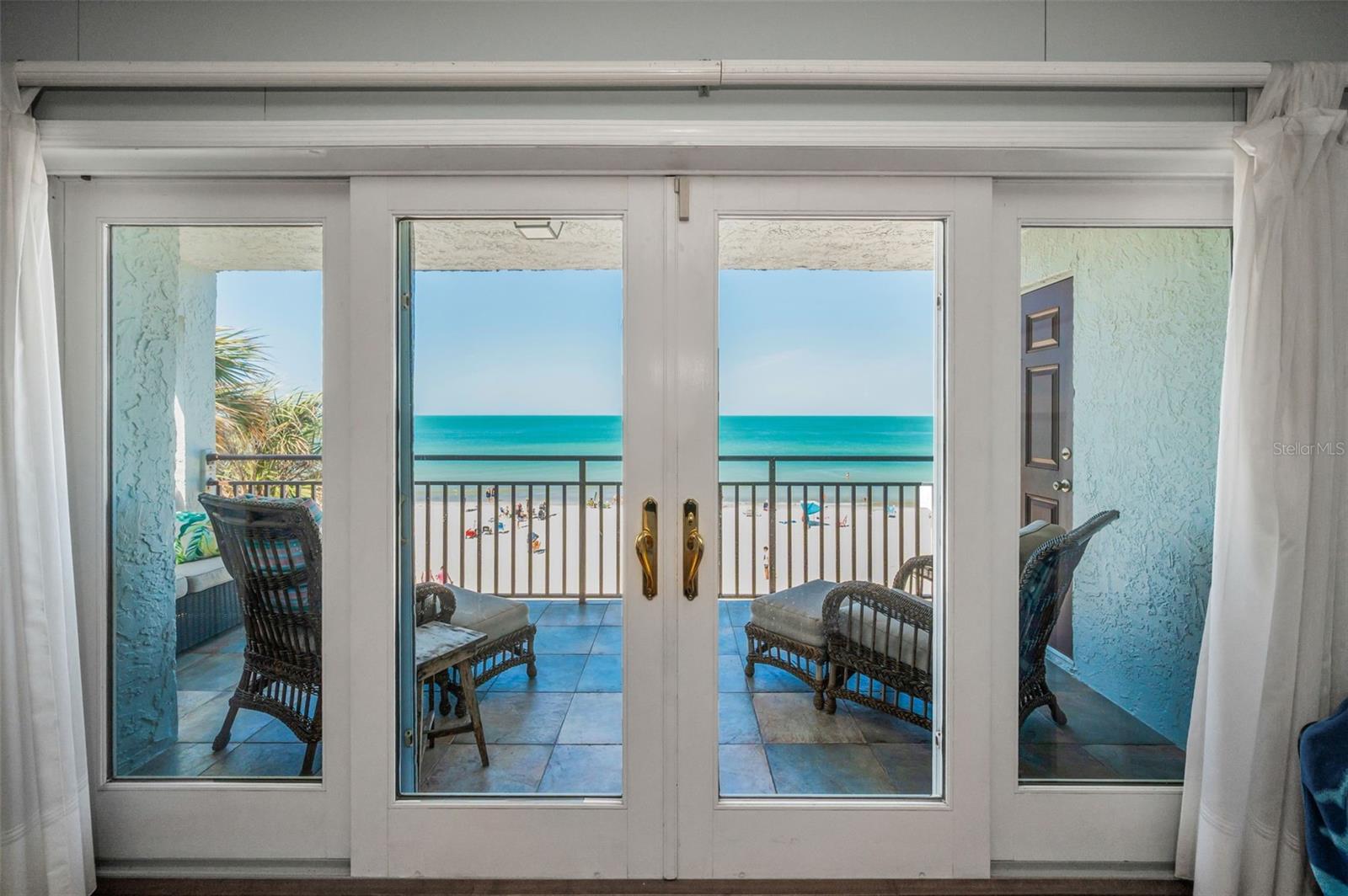 ... Living Room View - 12 foot of Glass - Direct Gulf fronts a 29'x 21.3 Greatroom - Doors Slide open with Storm shutters on Outside for easy Shutdown when departing. Additional Bay Windows on South end with Long Range Water Views from Living room.