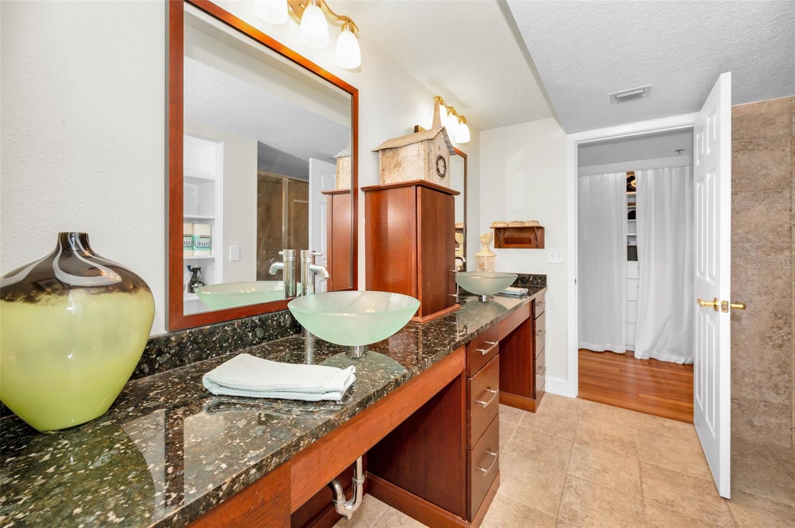 .. Master Bath 11.10 X 10 Looking Out to Hallway. Granite Countertops - Double Seagrass Vessel Basins - Plenty of Room Here.