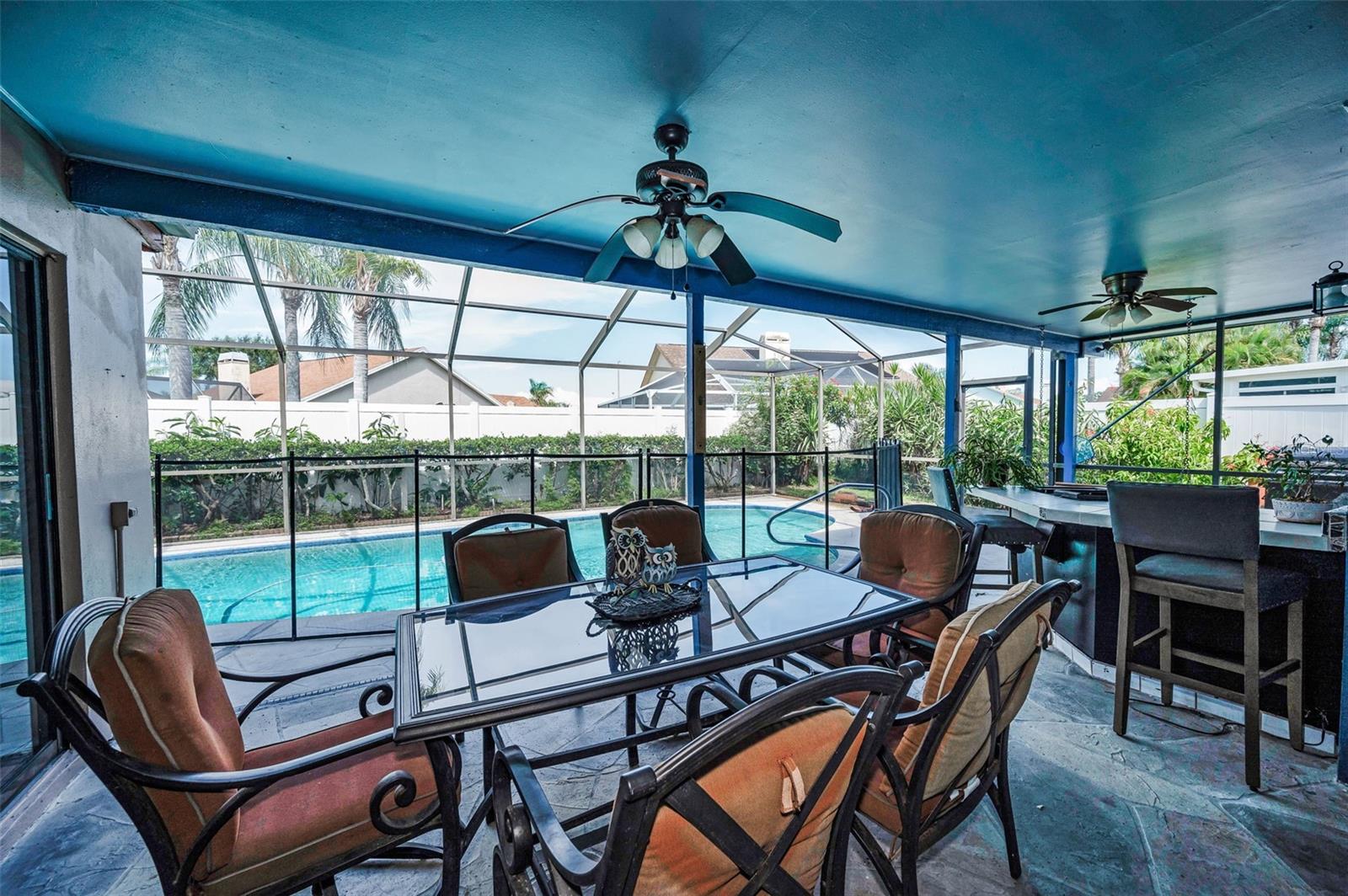COVERED TABLE AREA AND OUTDOOR KITCHEN WITH SNACK BAR