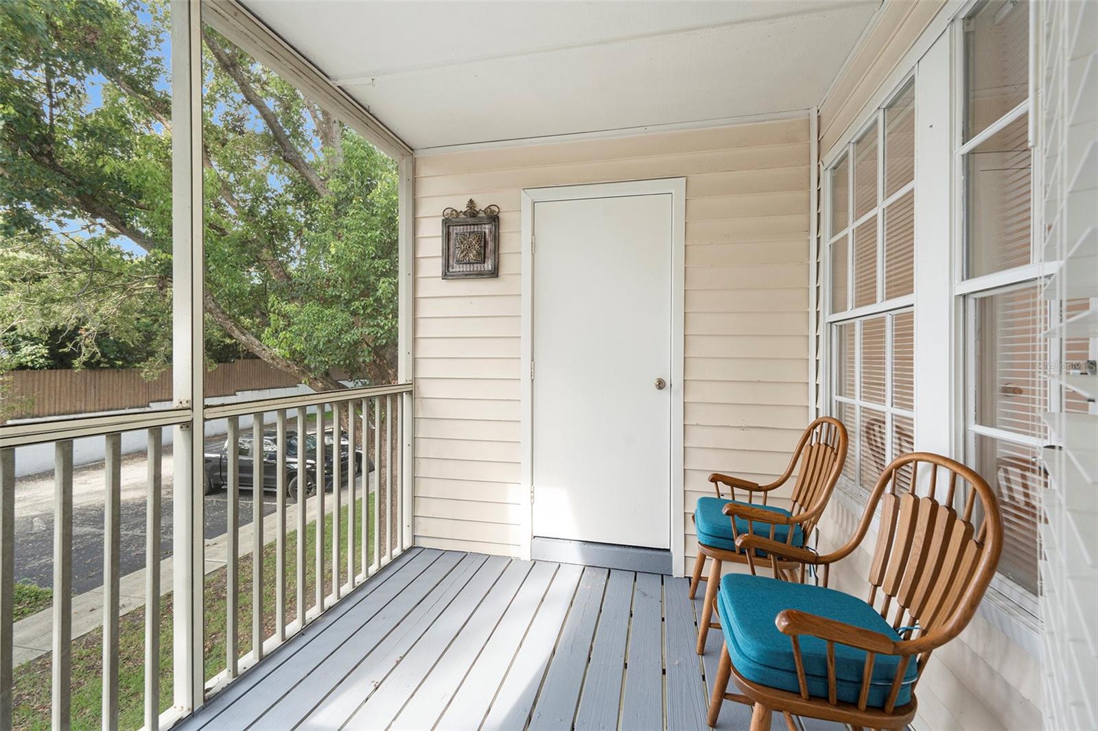 Unit's Private screened balcony and storage