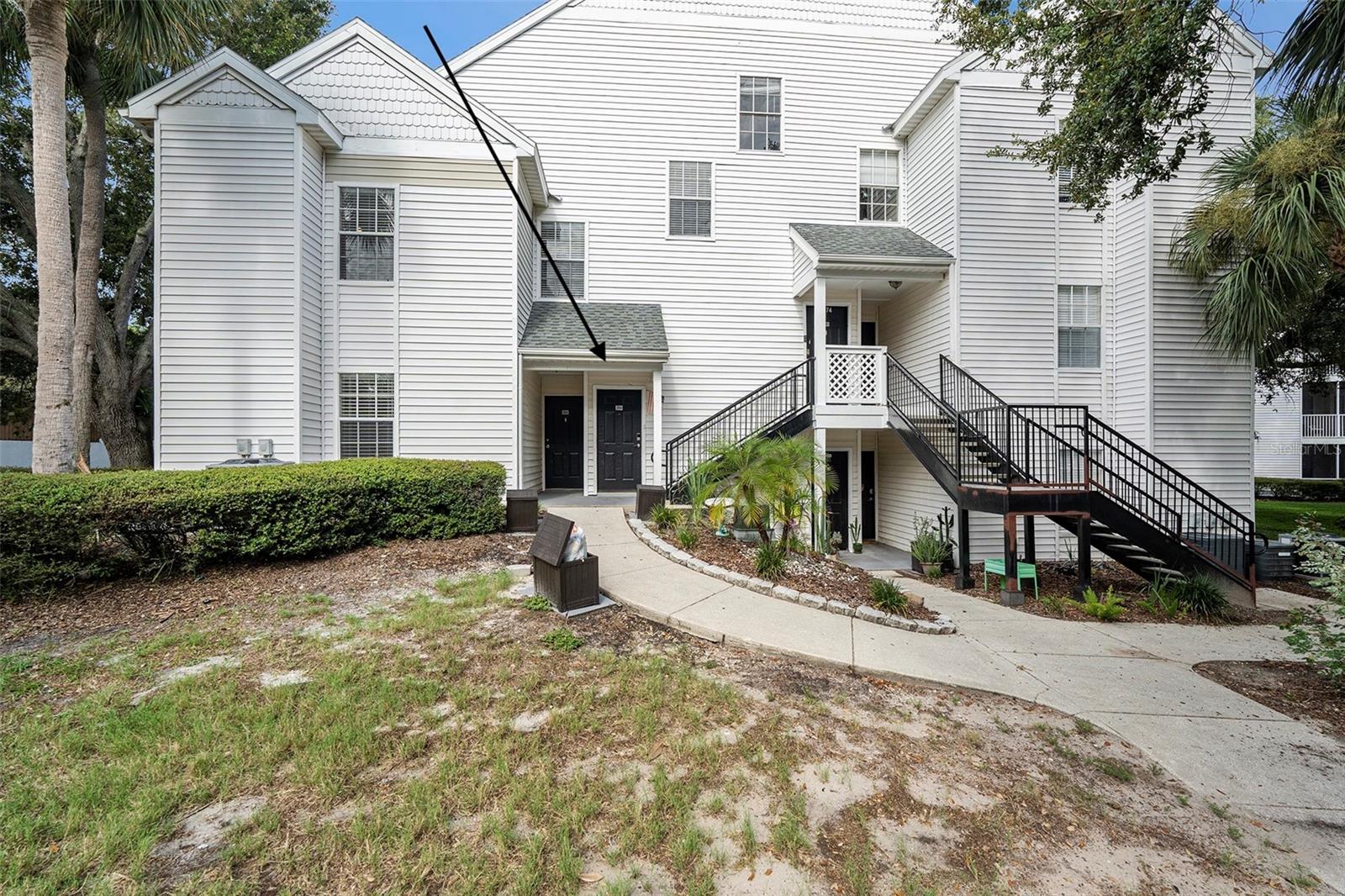 Middle entrance., private balcony on the left of the building