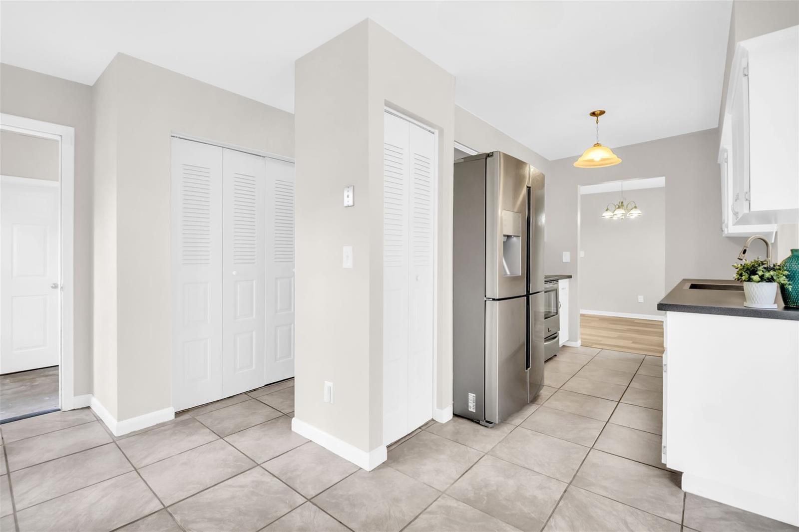 Nice sized kitchen pantry closet and access to convenient 1/2 bath, additional cabinet space, laundry room, & garage~
