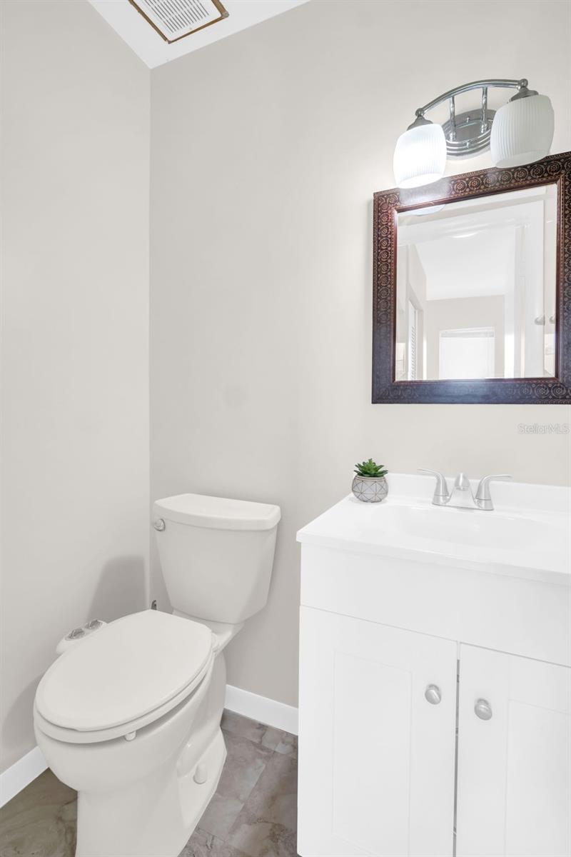 Updated 1/2 bath with new flooring, fresh paint, new vanity~