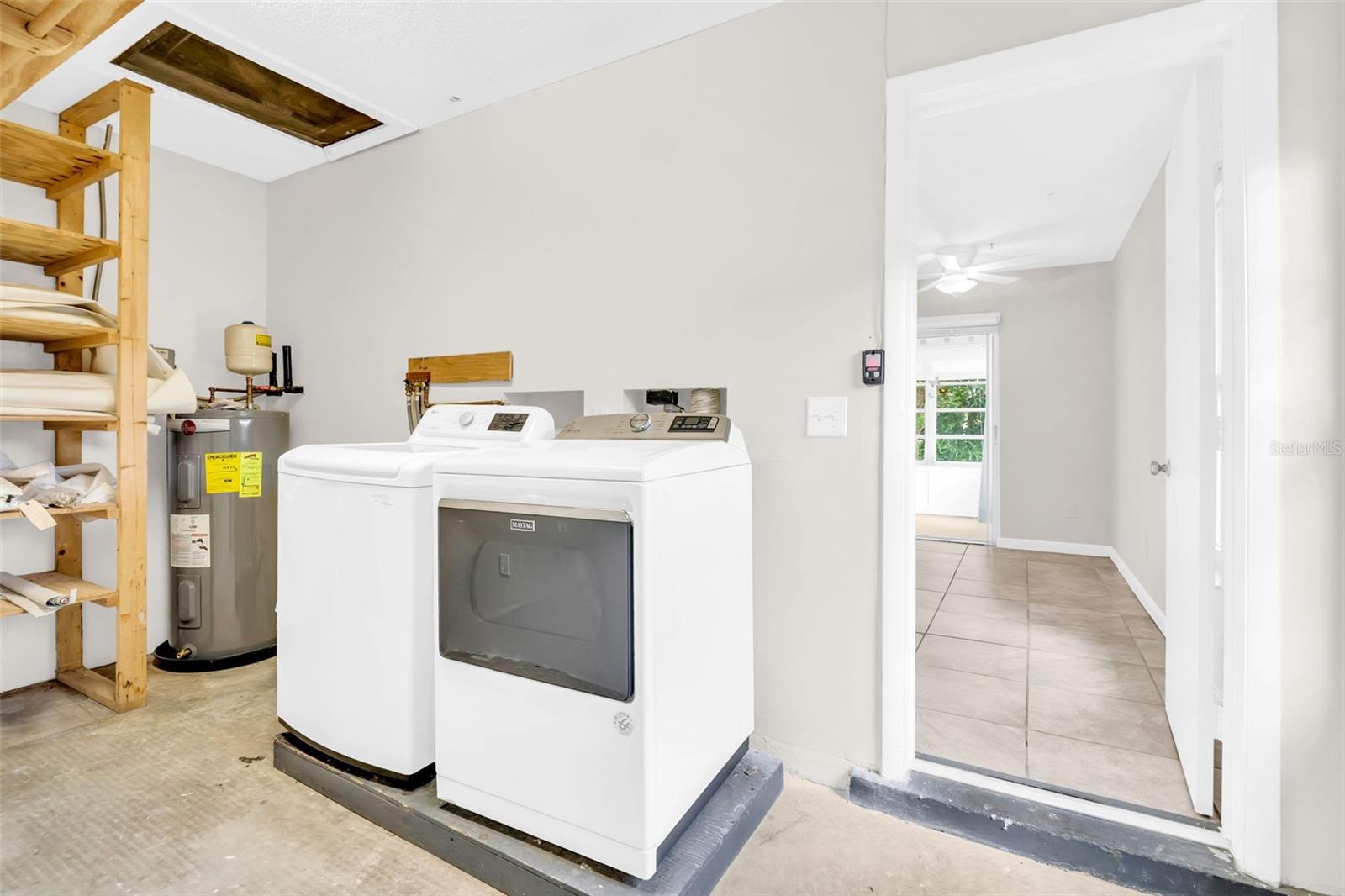 Laundry room perfectly tucked between the garage and main living~