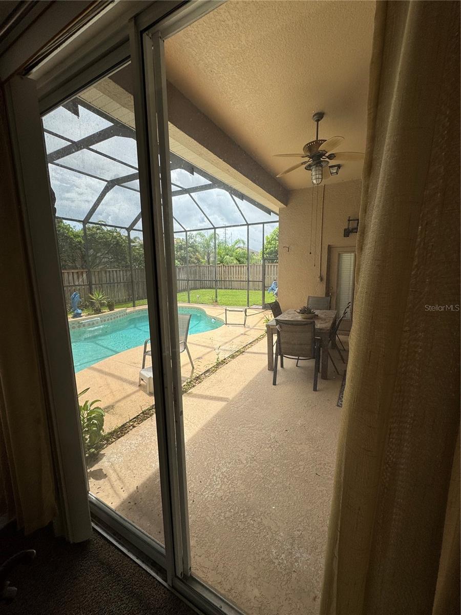 Sliding glass doors to Pool from Master Bedroom
